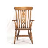 A 20th century beech slat back kitchen armchair CONDITION REPORT: Good,