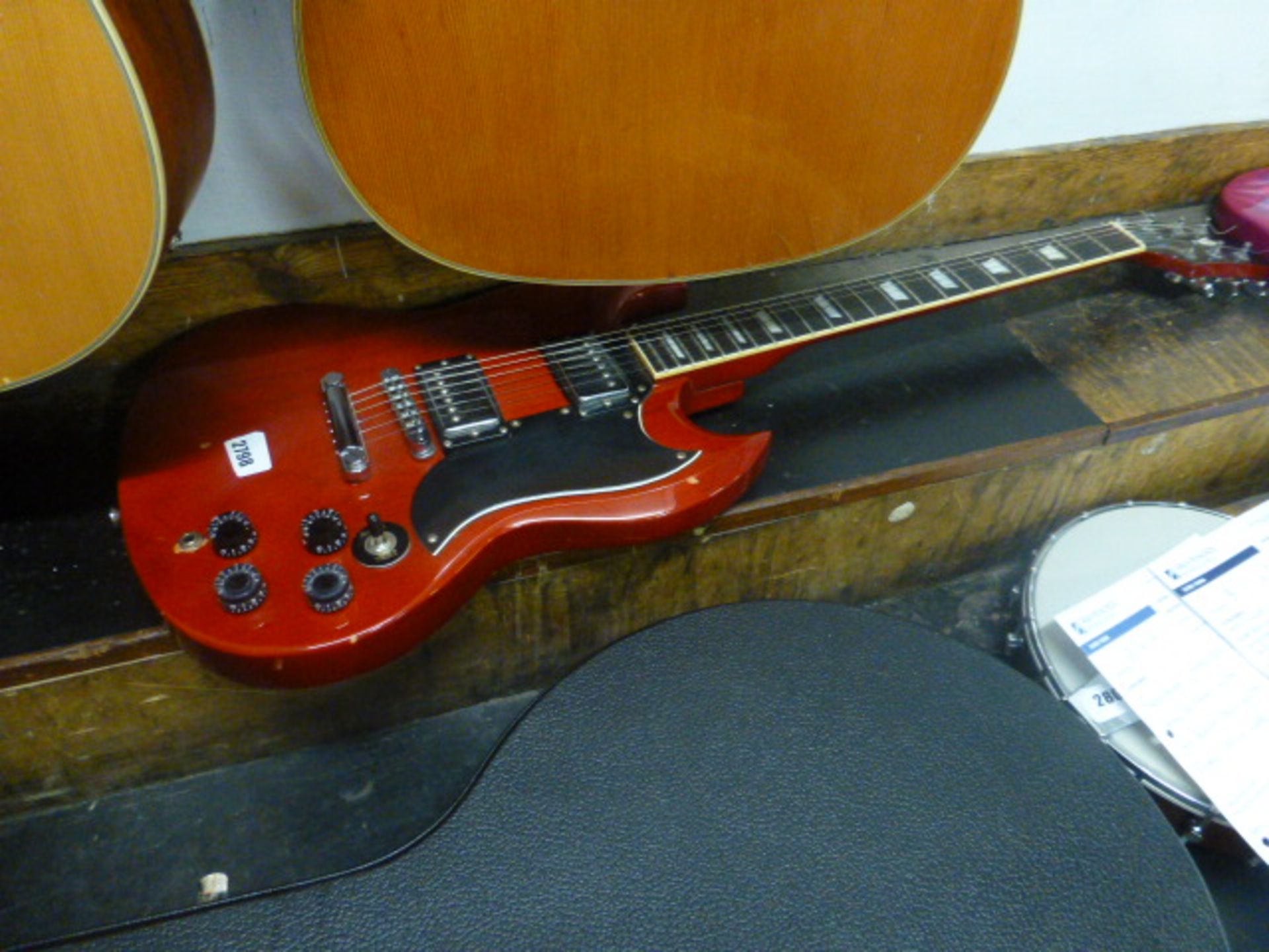 Unbranded electric guitar in red