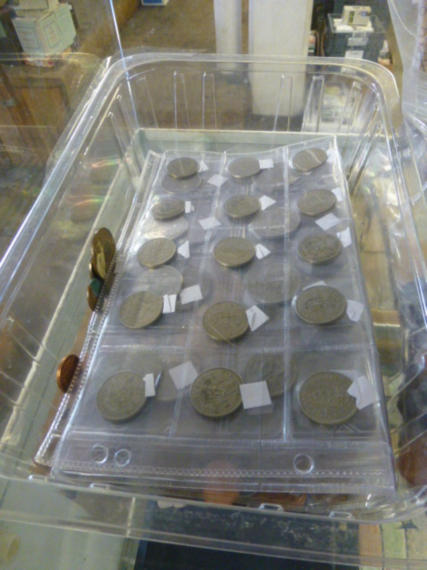 Tub of various coins and bank notes