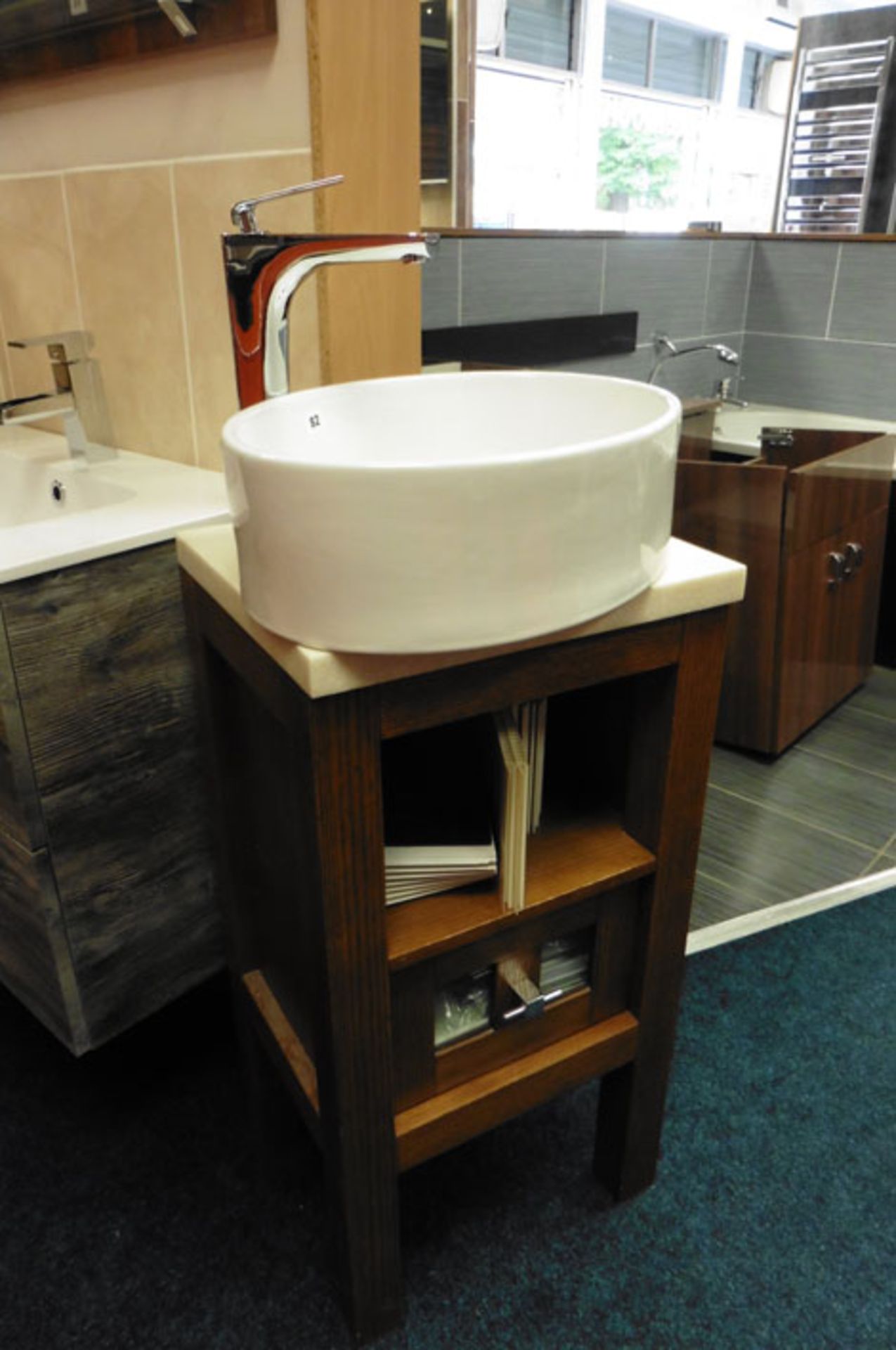 Oval basin with XR tall base and mixer tap and a wooden framed and marble topped free standing