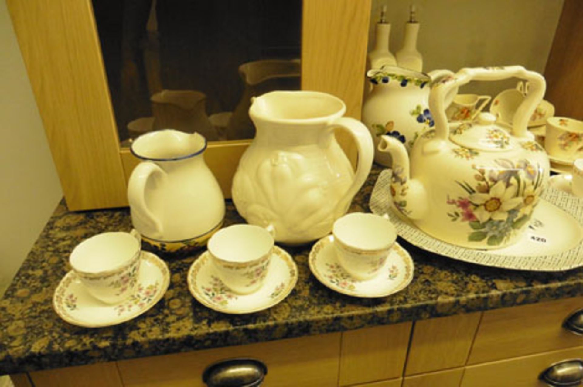 A collection of assorted crockery, jugs, teapot, etc