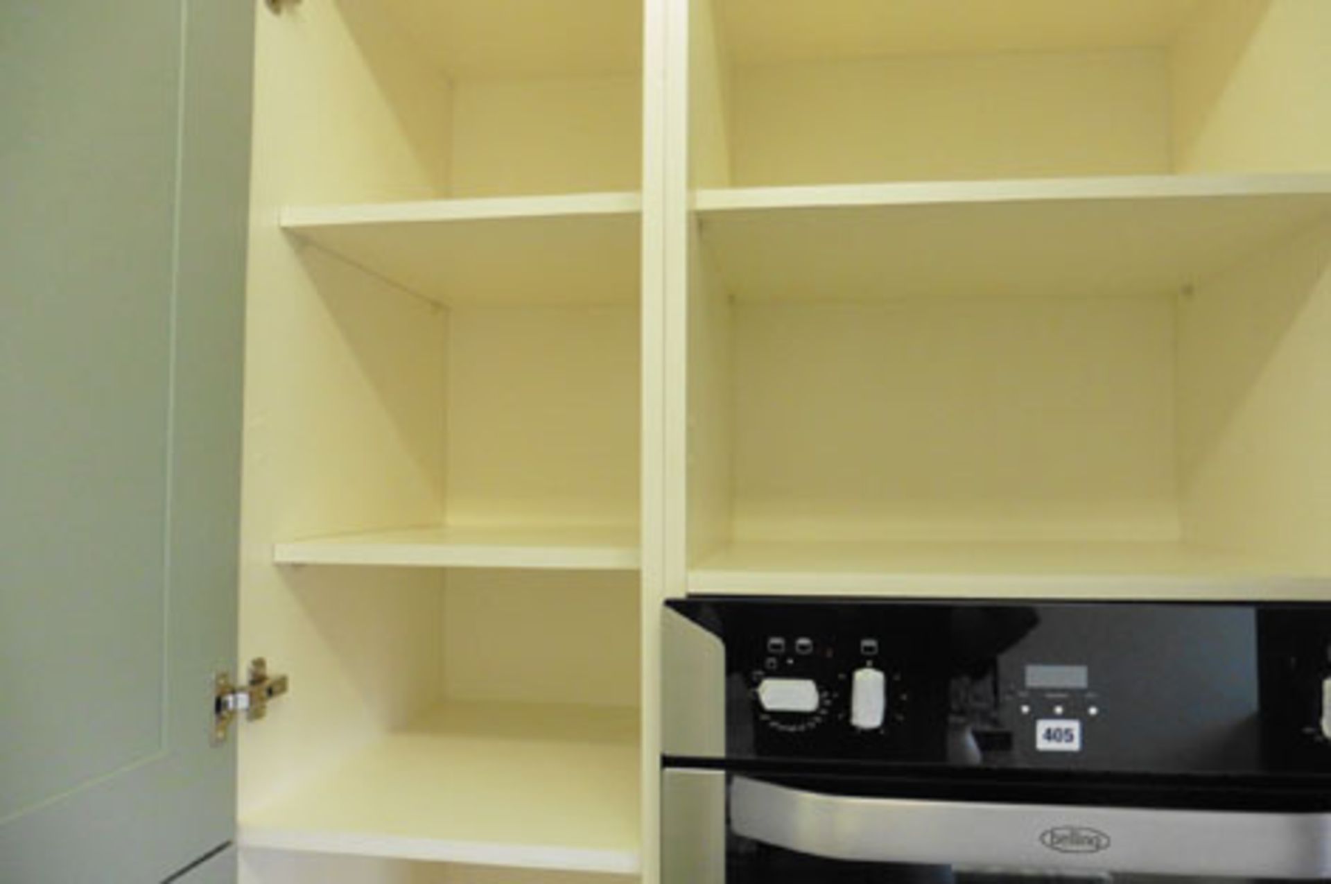 A small kitchen display in olive green finish in a shaker-style, with a pull-out larder cupboard ( - Image 2 of 3