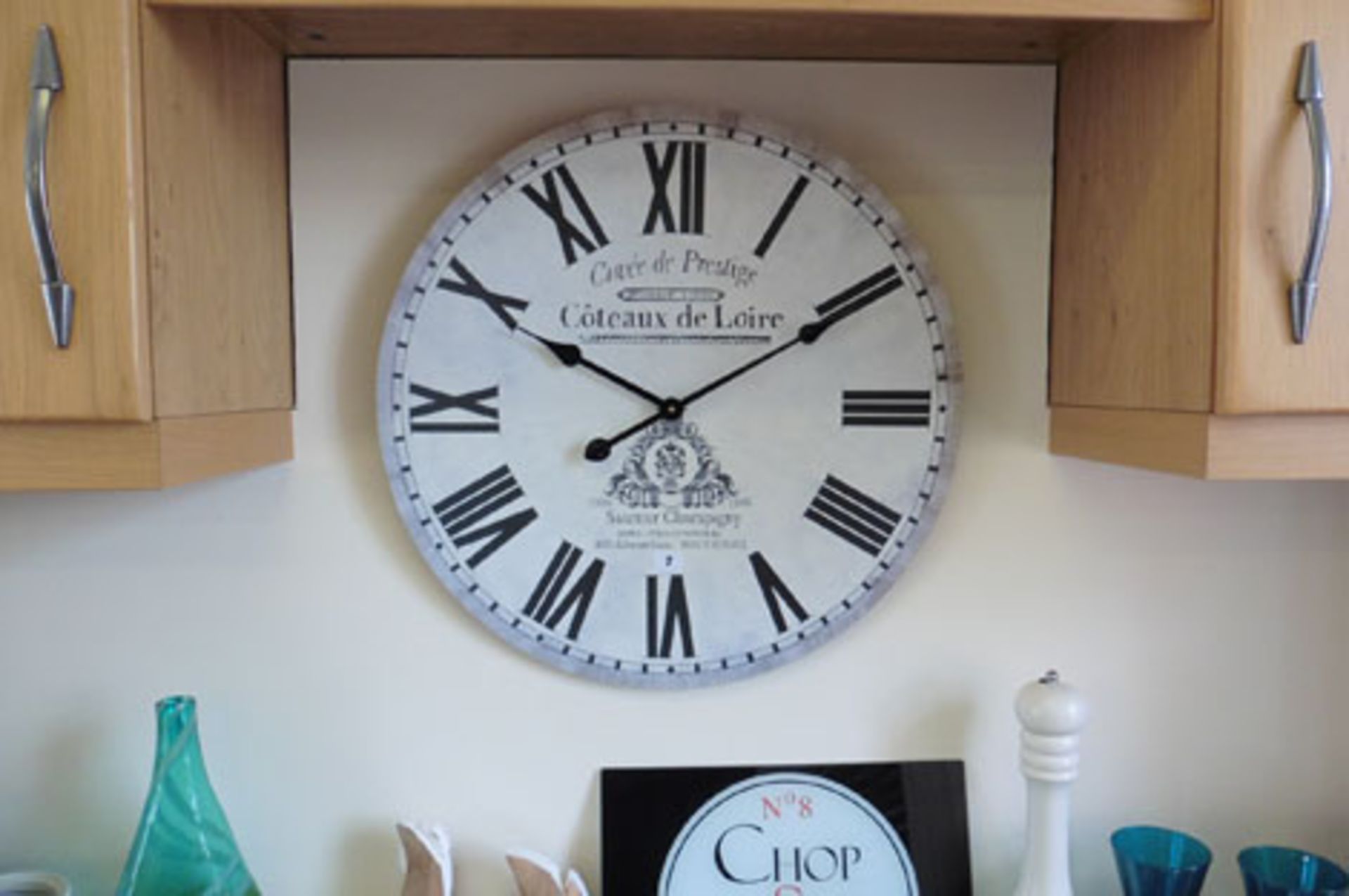 Loose display items including quartz clock, vase, bread bin, cheese bin, kettle, glassware, chopping