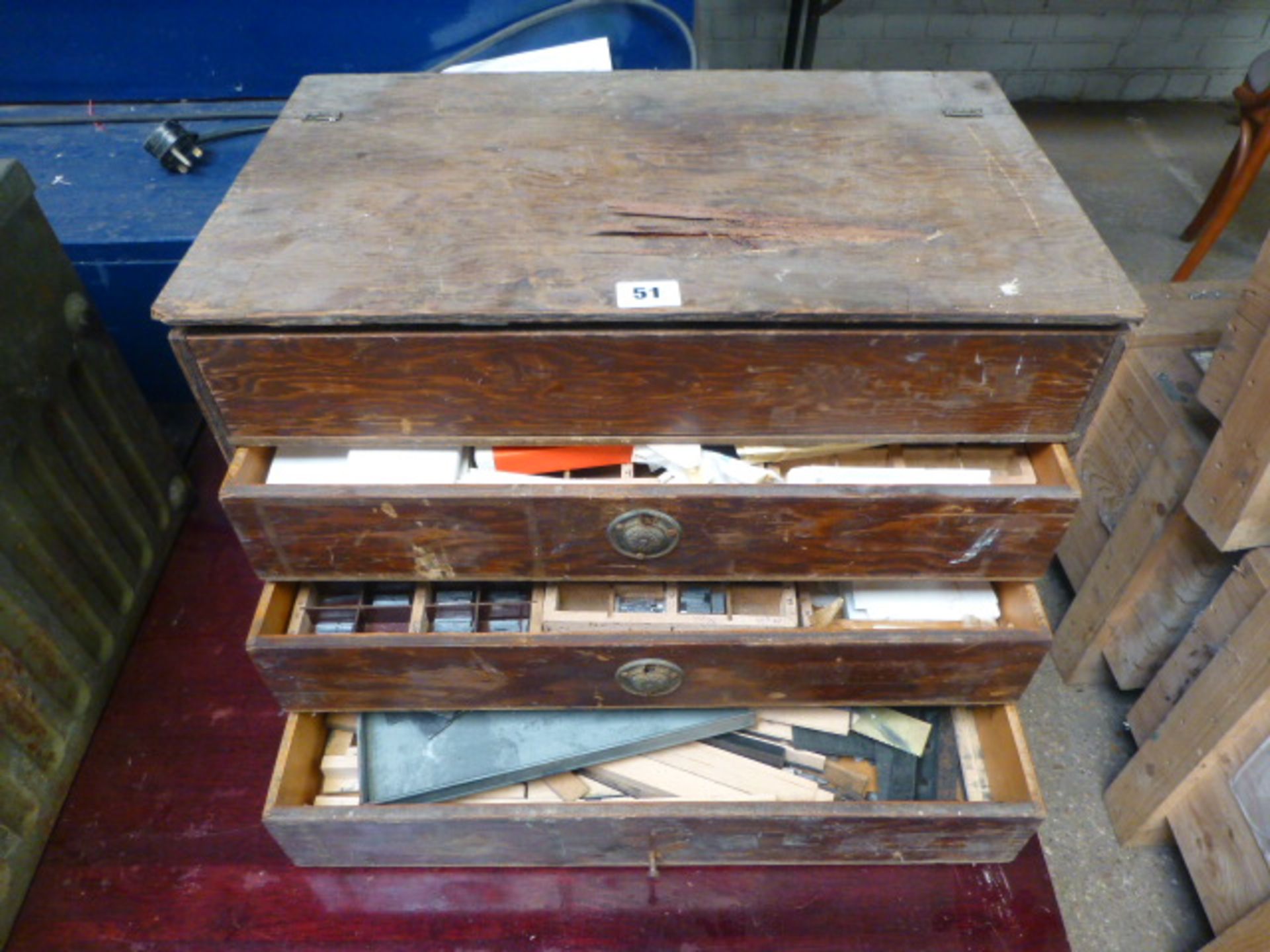 Plywood 3 drawer and lift top printers cabinet with contents to include letter stamps and print