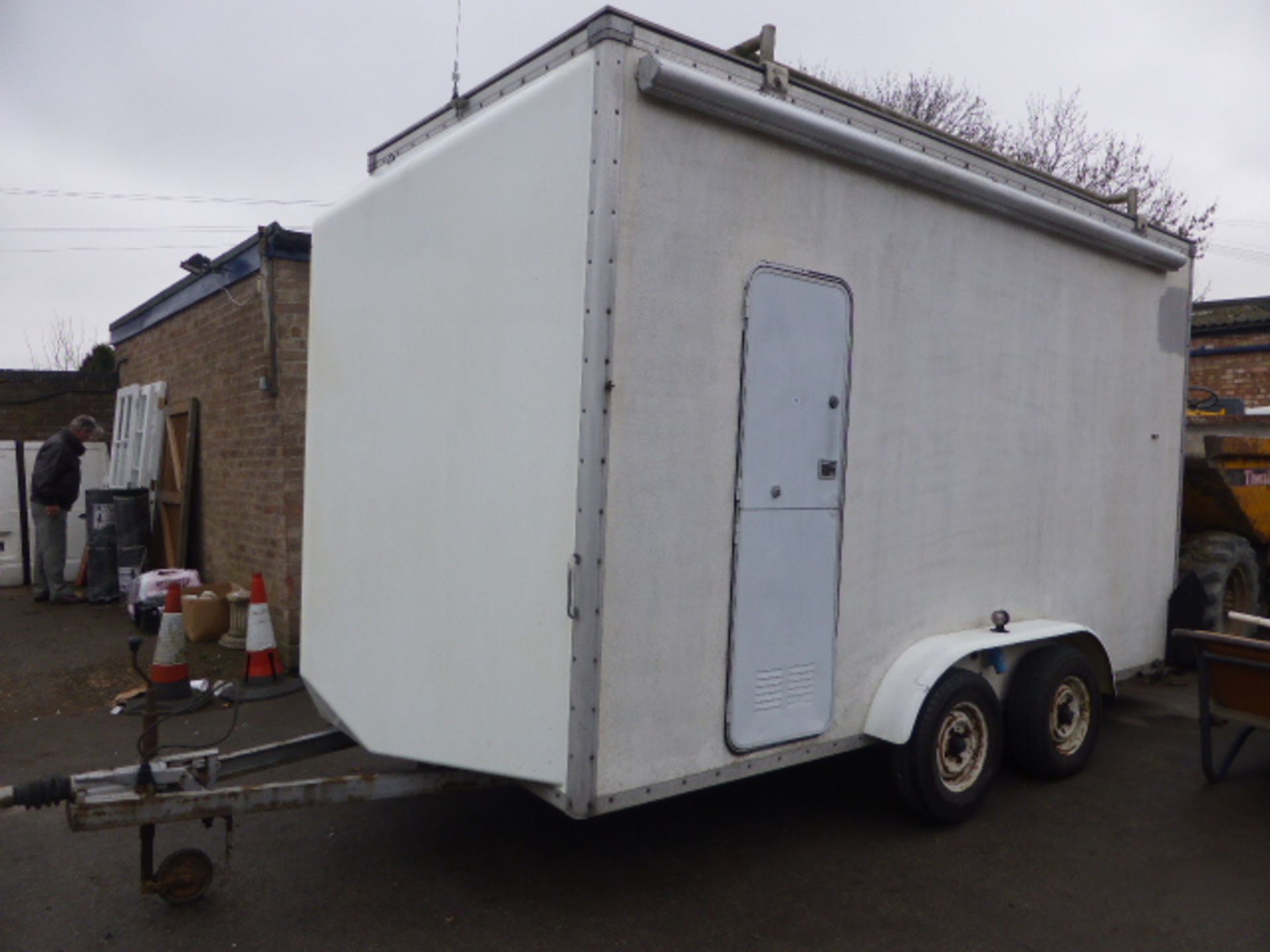 13' x 5' twin axle box trailer used recently as site office with roller door to rear, side door..