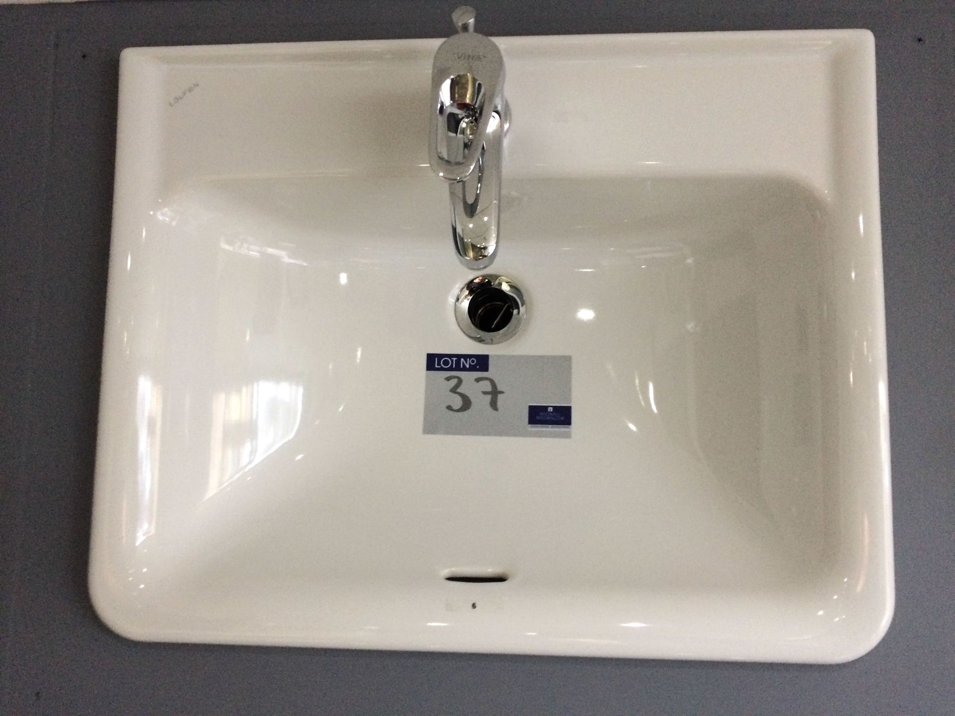 A Laufen Pluto 55cm Countertop Wash Basin with Vitra Twist Chrome Mixer Tap.