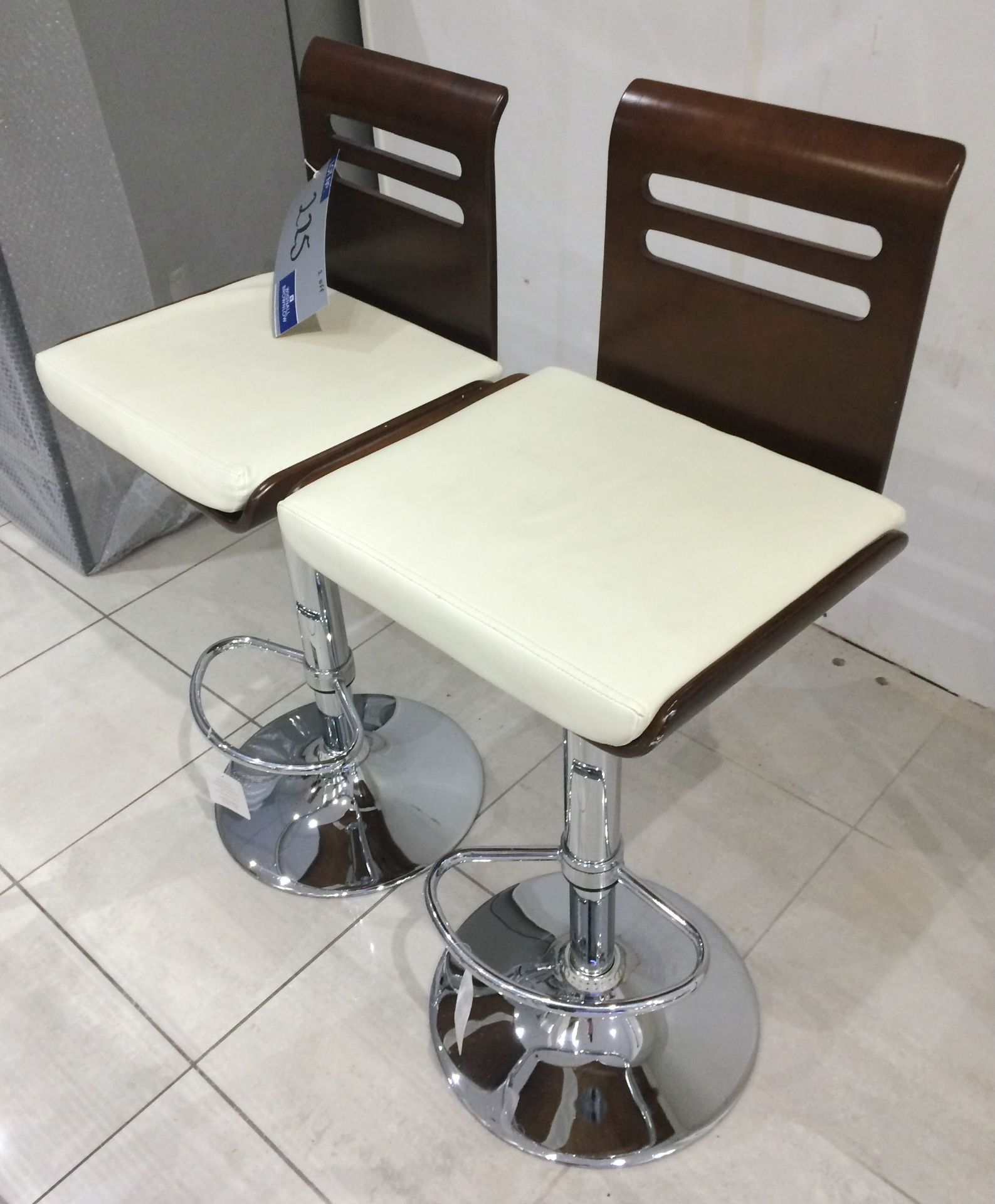 2 Cream Leather and Wood Effect Chrome Base Adjustable Height Bar Chairs.