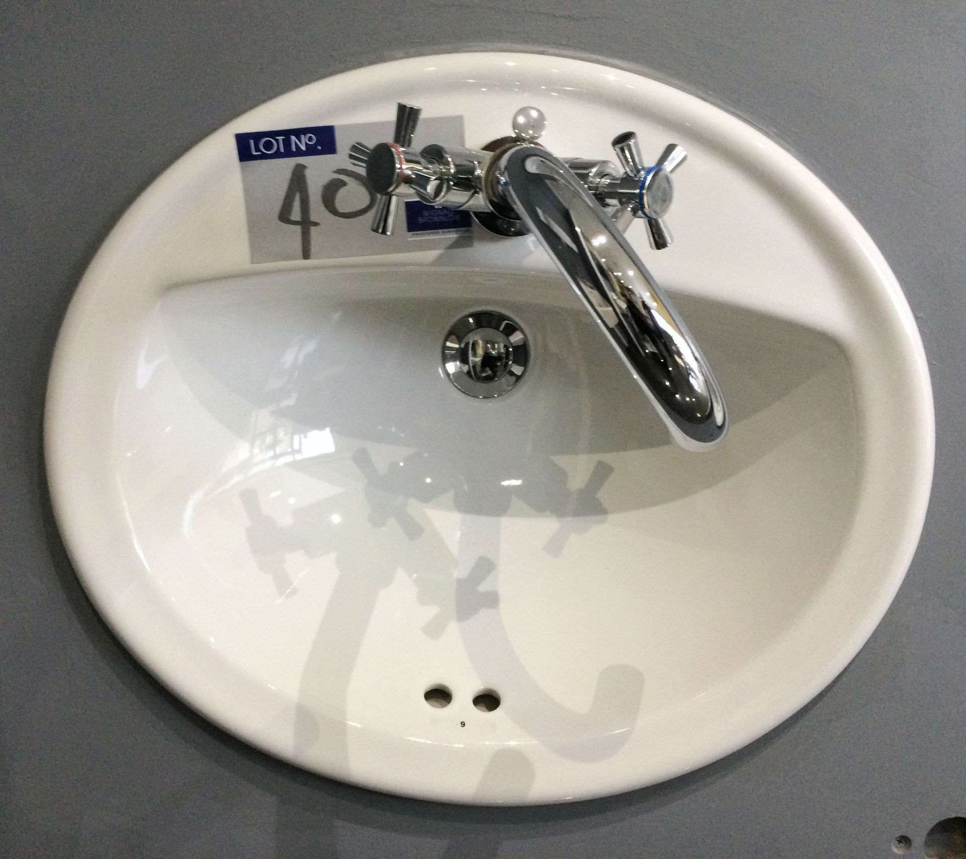 A Vitra Matrix 50cm Countertop Hand Basin with Pegler Slique Chrome Mixer Tap.