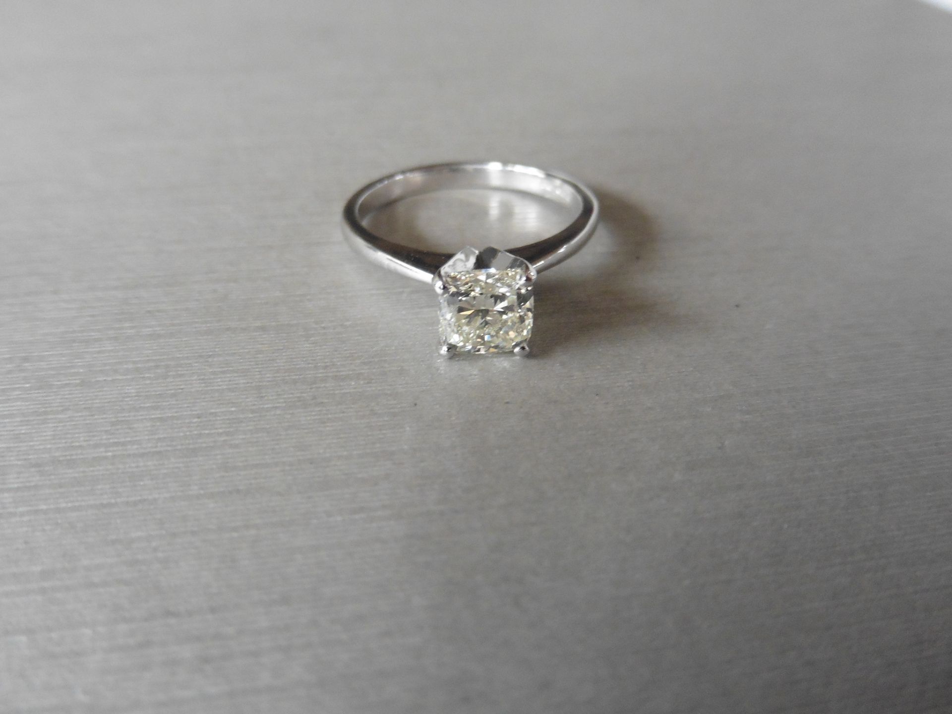 1.02ct radiant cut diamond solitaire ring set in 18ct white gold. J colour VVS2 clarity. EGL
