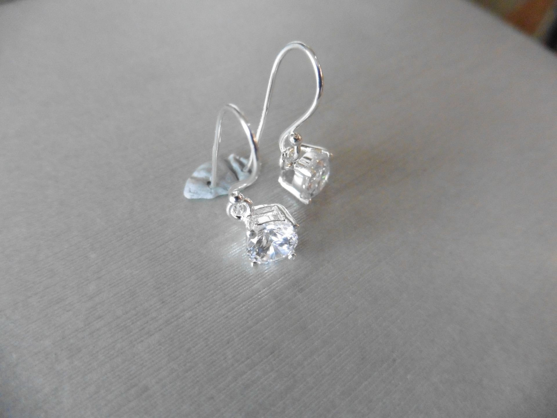 0.80ct diamond drop style solitaire earrings each set with a brilliant cut diamond, I colour, Si2 - Image 2 of 2