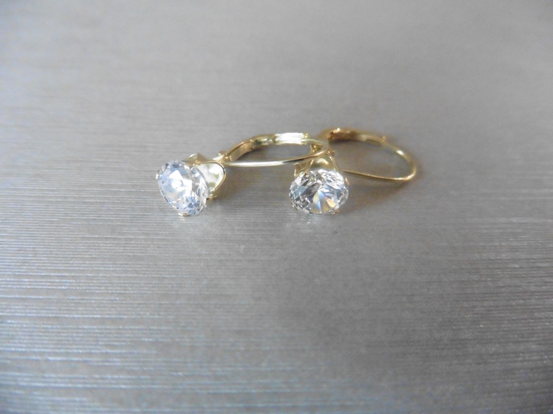 0.80ct diamond hinged style earrings each set with a brilliant cut diamond, I colour,Si2 clarity. - Image 2 of 3