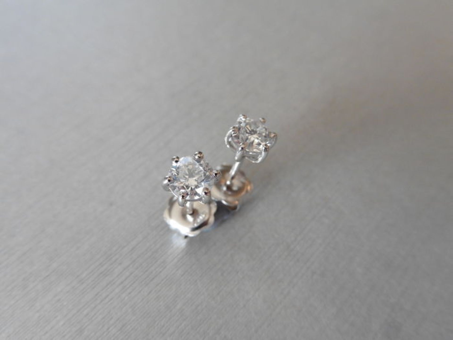 1.00ct Diamond solitaire earrings set with brilliant cut diamonds, I colour SI2 clarity. Six claw