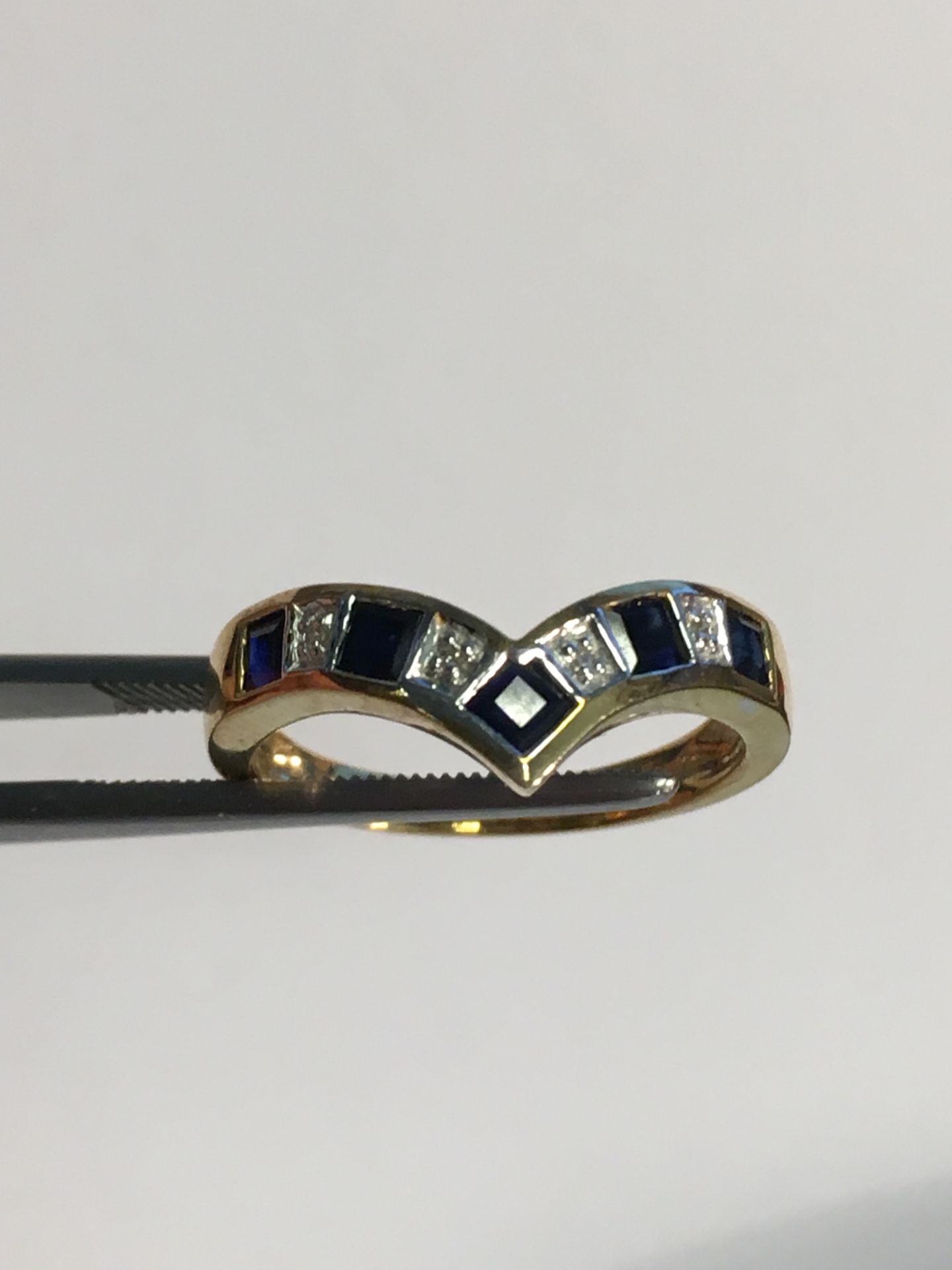 Ladies Gold Ring Set with Five sapphires and diamonds in a wishbone style