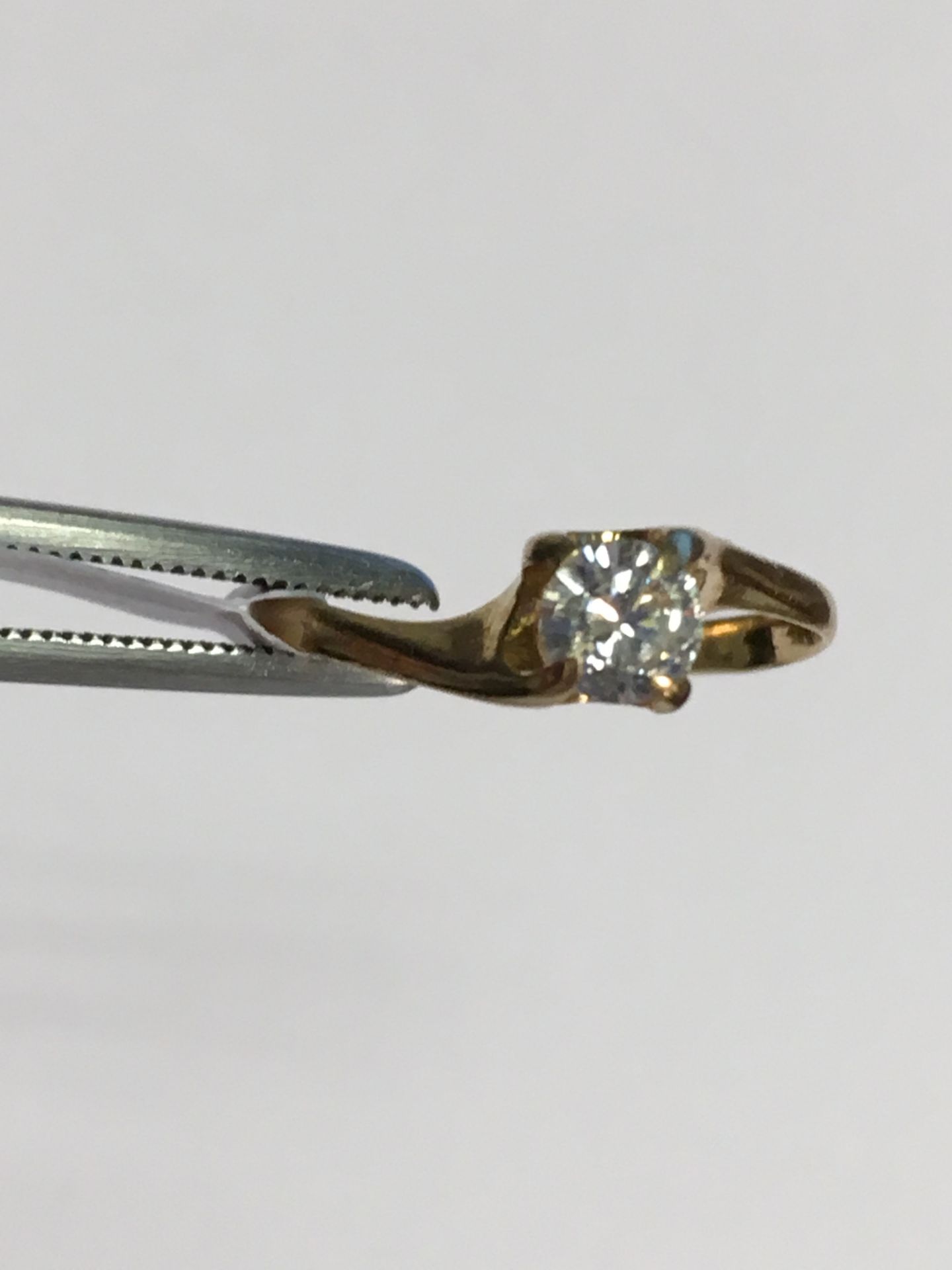 A diamond single-stone ring. The brilliant-cut diamond 0.25ct - Image 2 of 3