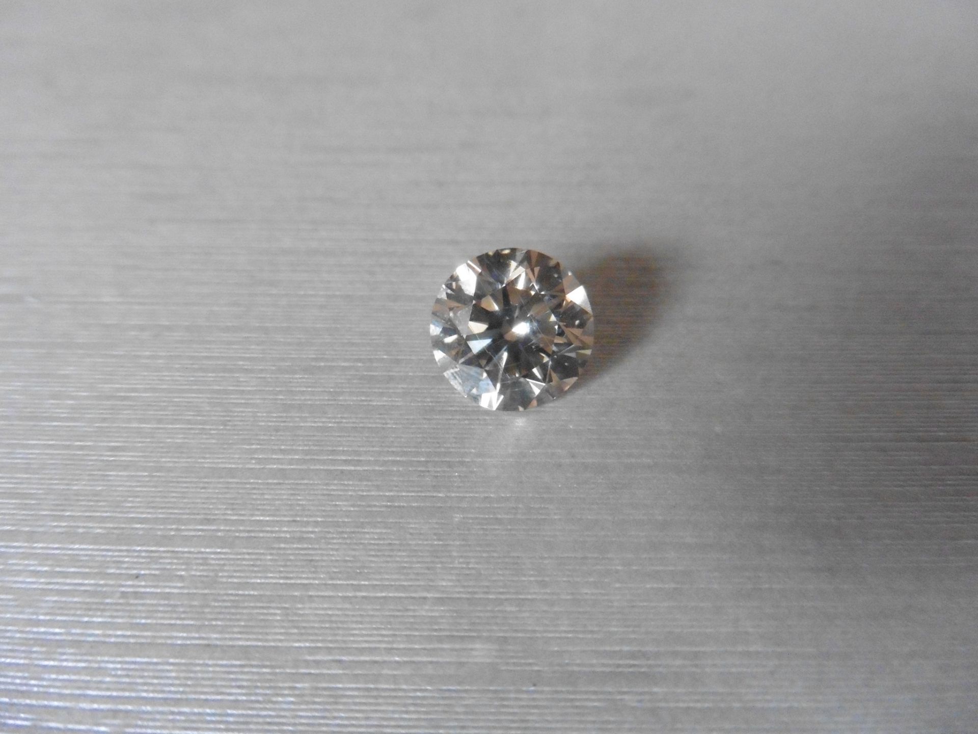 4.41ct single brilliant cut diamond. Measures 10.44 x 6.57 mm.