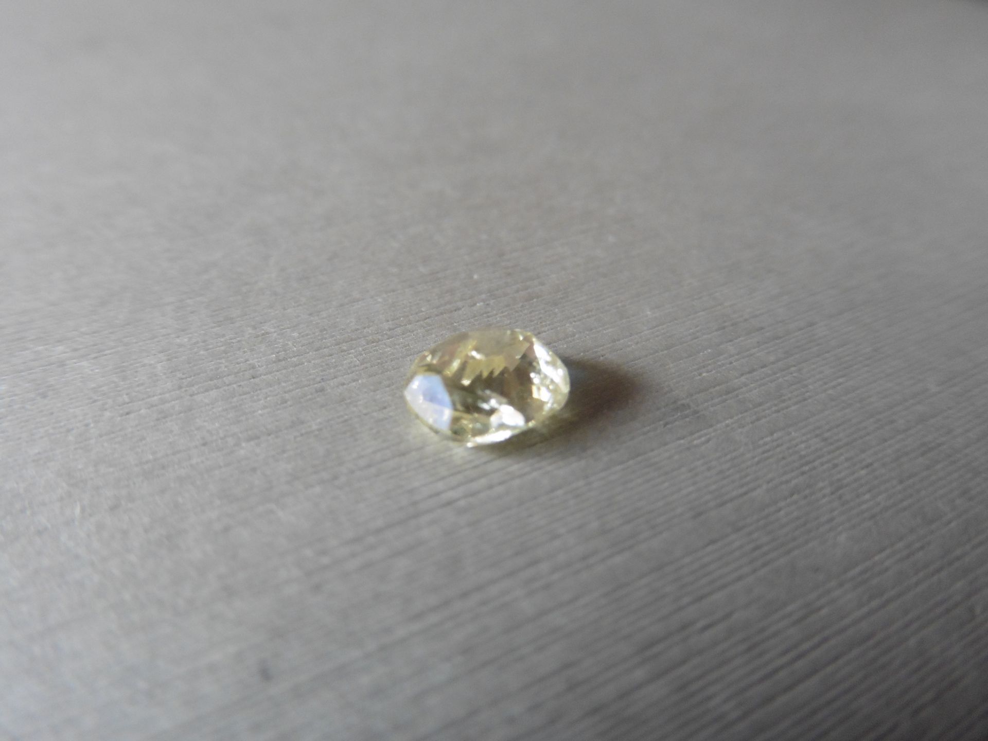 1.57ct loose cushion cut diamond. Fancy yellow colour and I1 clarity. 7.13 x 6.22 x 4.09mm. - Image 2 of 4