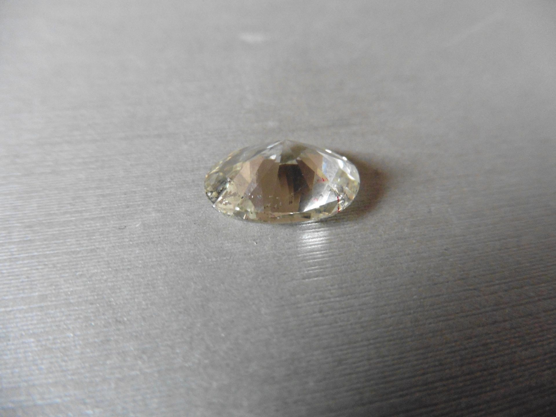 6.05ct single oval cut diamond. Measures 14.44 x 10.33 x 6.17mm. K-L colour, Si clarity. - Image 3 of 5