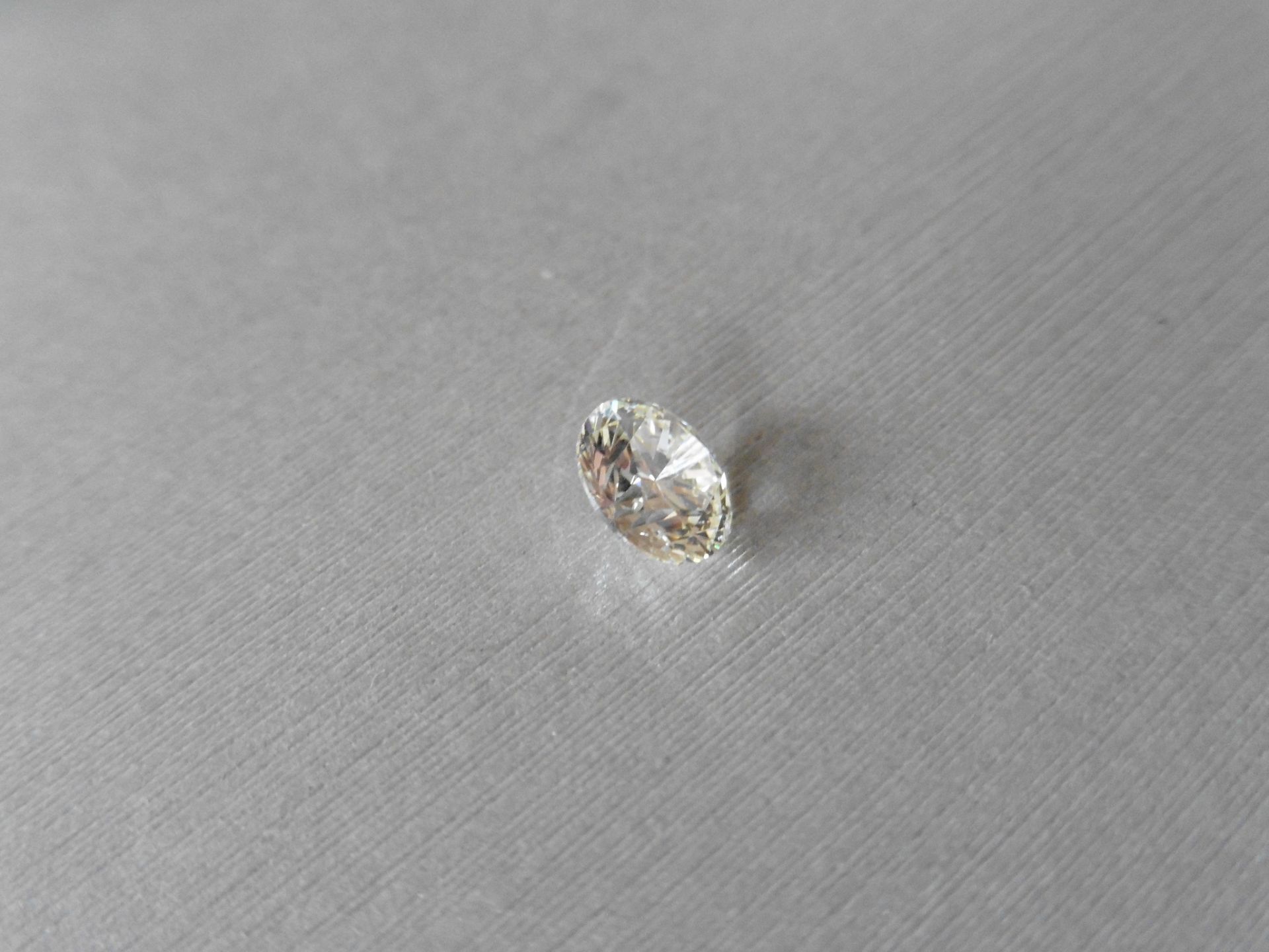 1.21ct single brilliant cut diamond, K colour VS2 clarity. 6.79 mm x 6.81mm x 4.22mm.