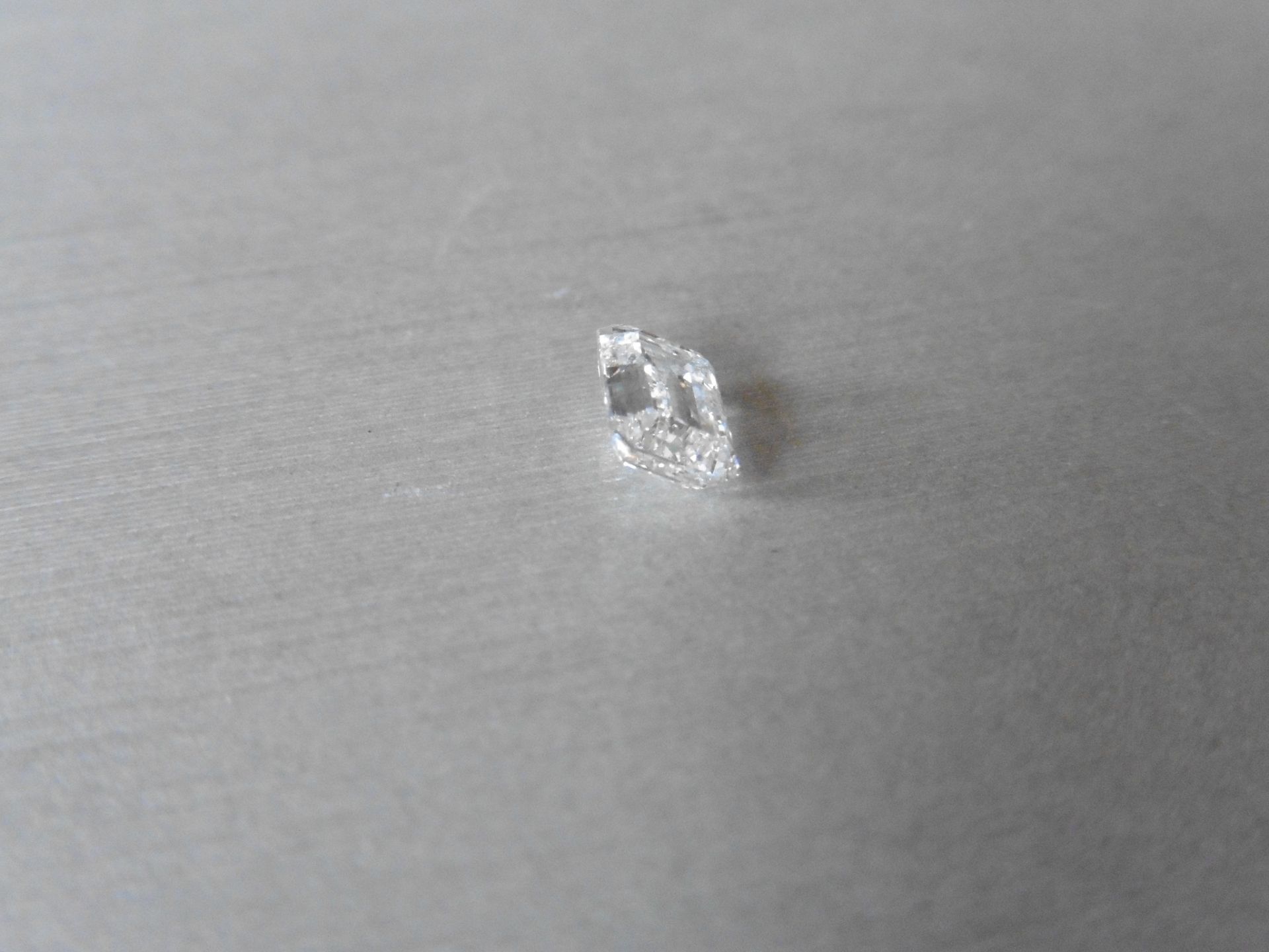 1.50ct single emerald cut diamond. Measures 7.67 x 5.41 x 3.53mm. F colour SI2 clarity.