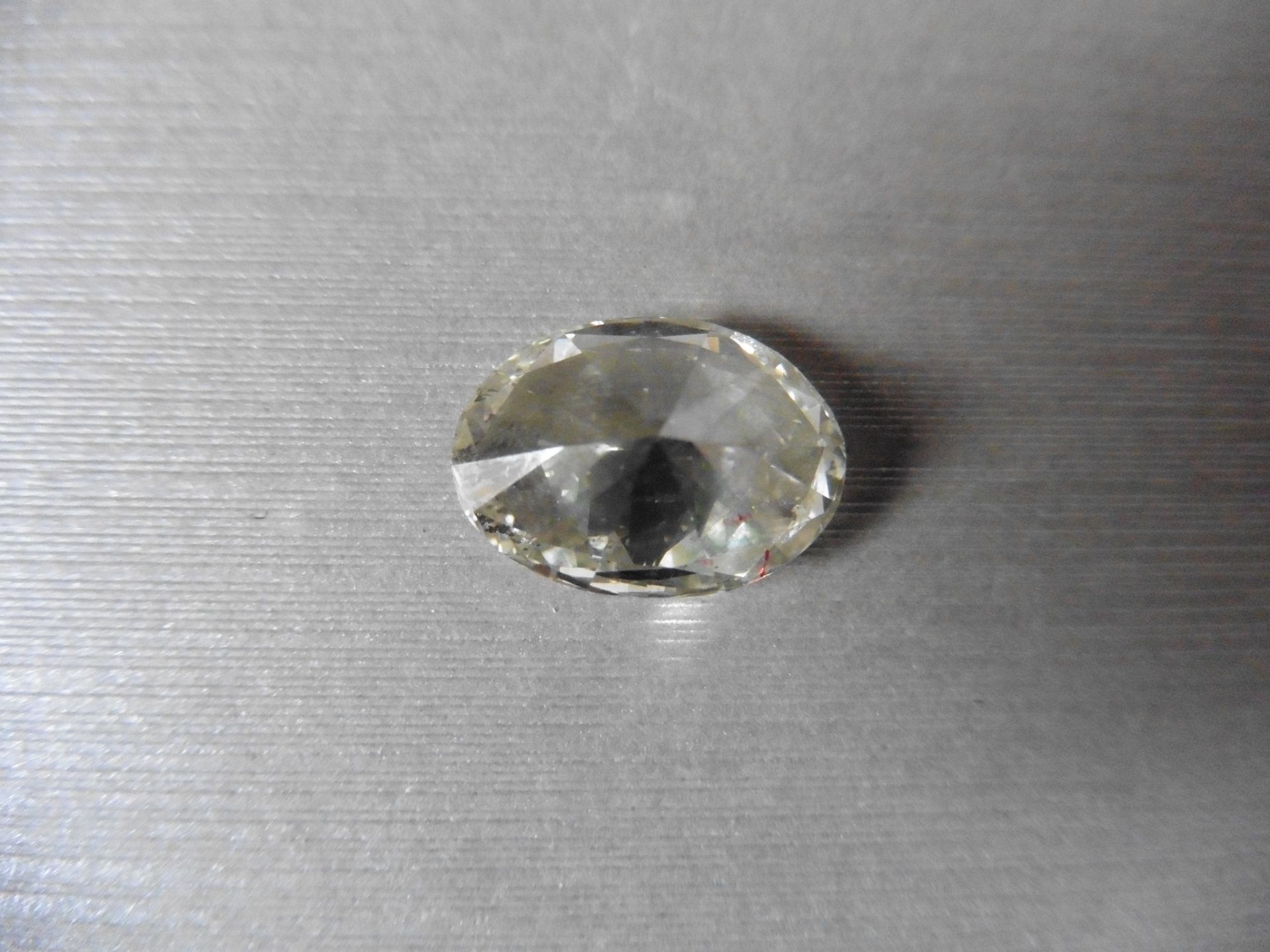 6.05ct single oval cut diamond. Measures 14.44 x 10.33 x 6.17mm. K-L colour, Si clarity. - Image 4 of 5