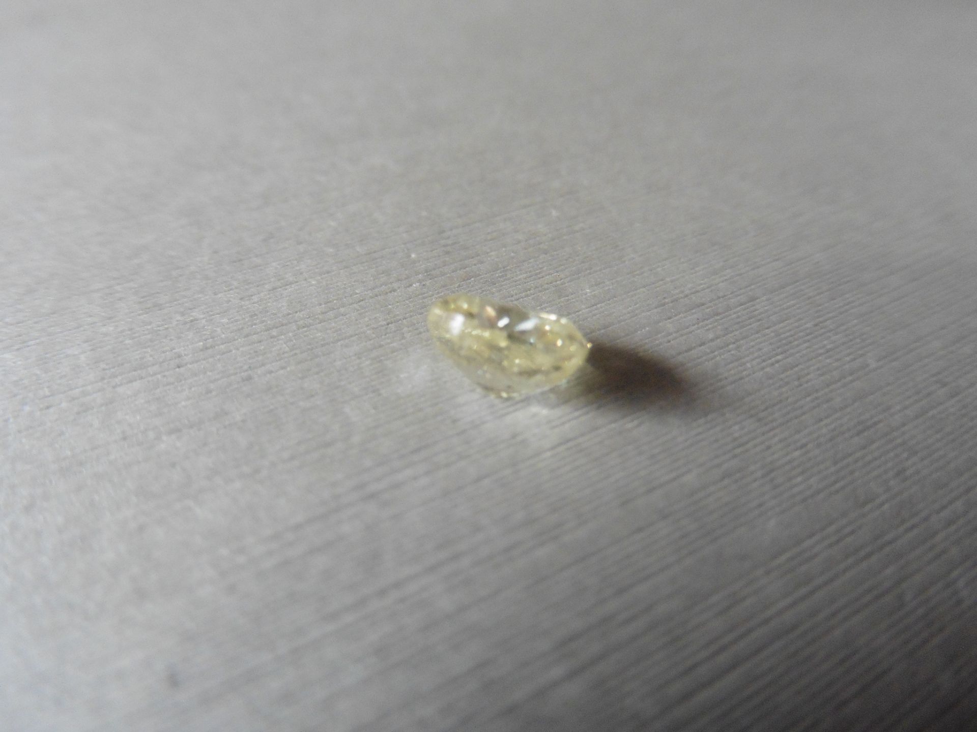 1.57ct loose cushion cut diamond. Fancy yellow colour and I1 clarity. 7.13 x 6.22 x 4.09mm.