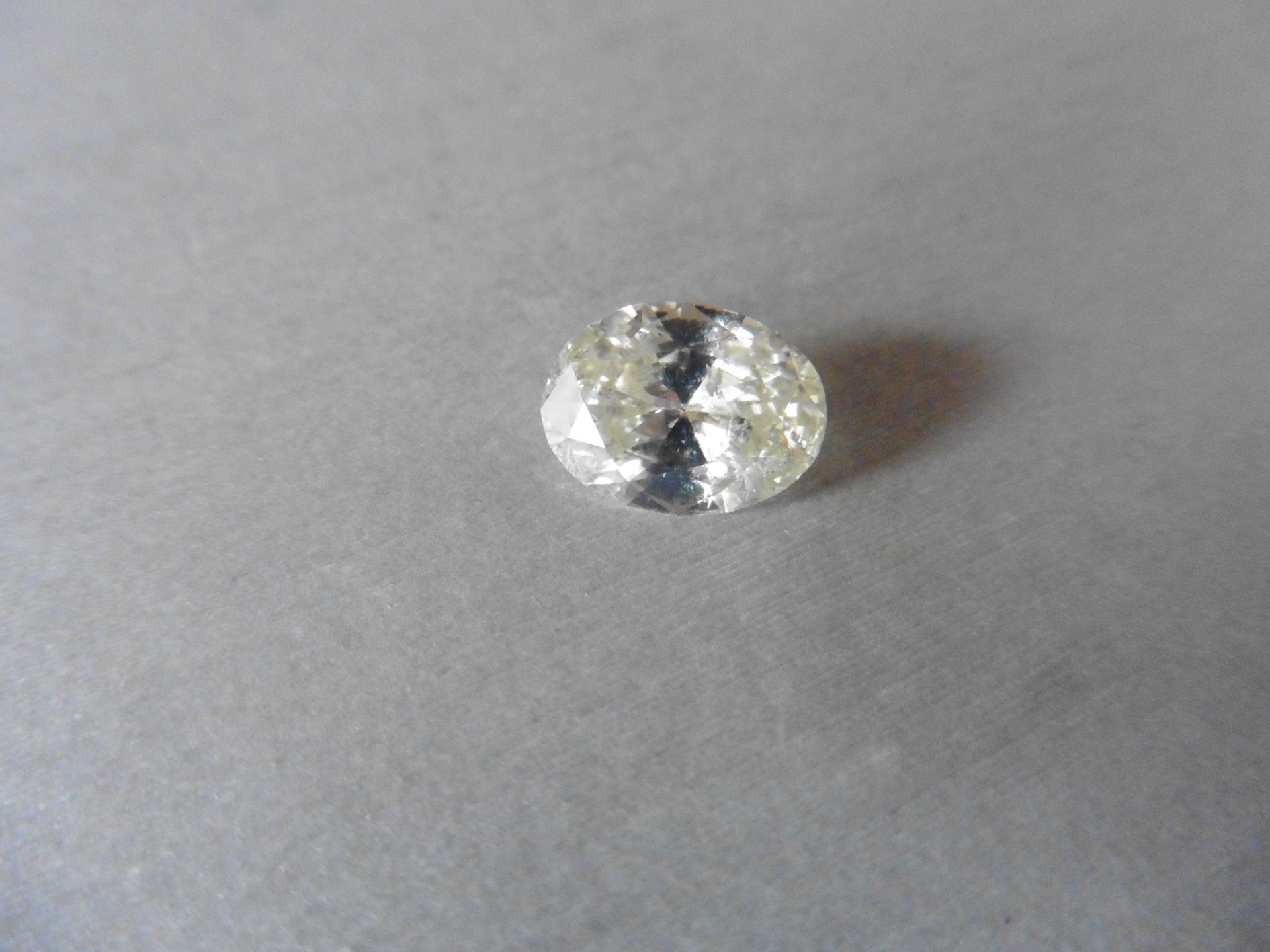 4.41ct single oval cut diamond. Measures 12.66 x 9.38 x 5.40mm. I colour, si3 clarity