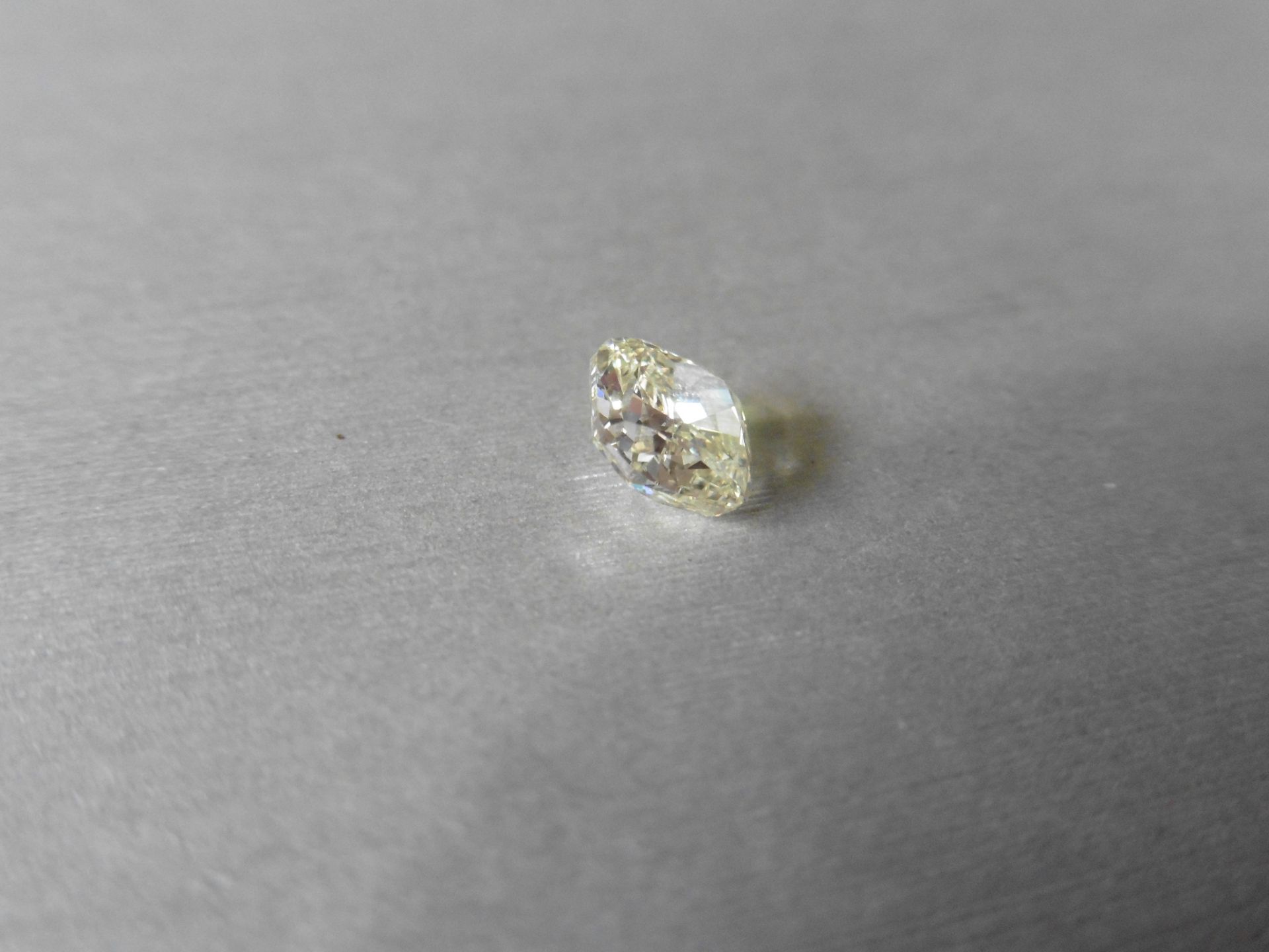 1.33ct loose cushion cut diamond. Fancy yellow colour ( y-z) VVS2 clarity. 6.59 x 6.32 x 3.79mm.