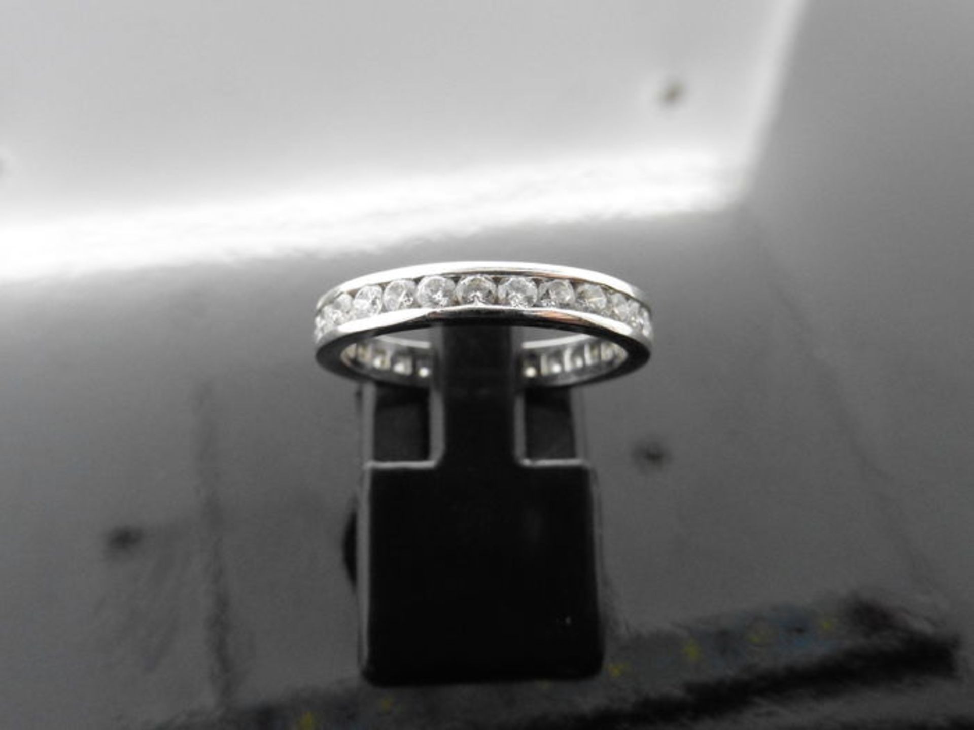 1.00ct full diamond band ring. Channel setting with brilliant cut diamonds, I colour, si2 clarity. - Image 2 of 3