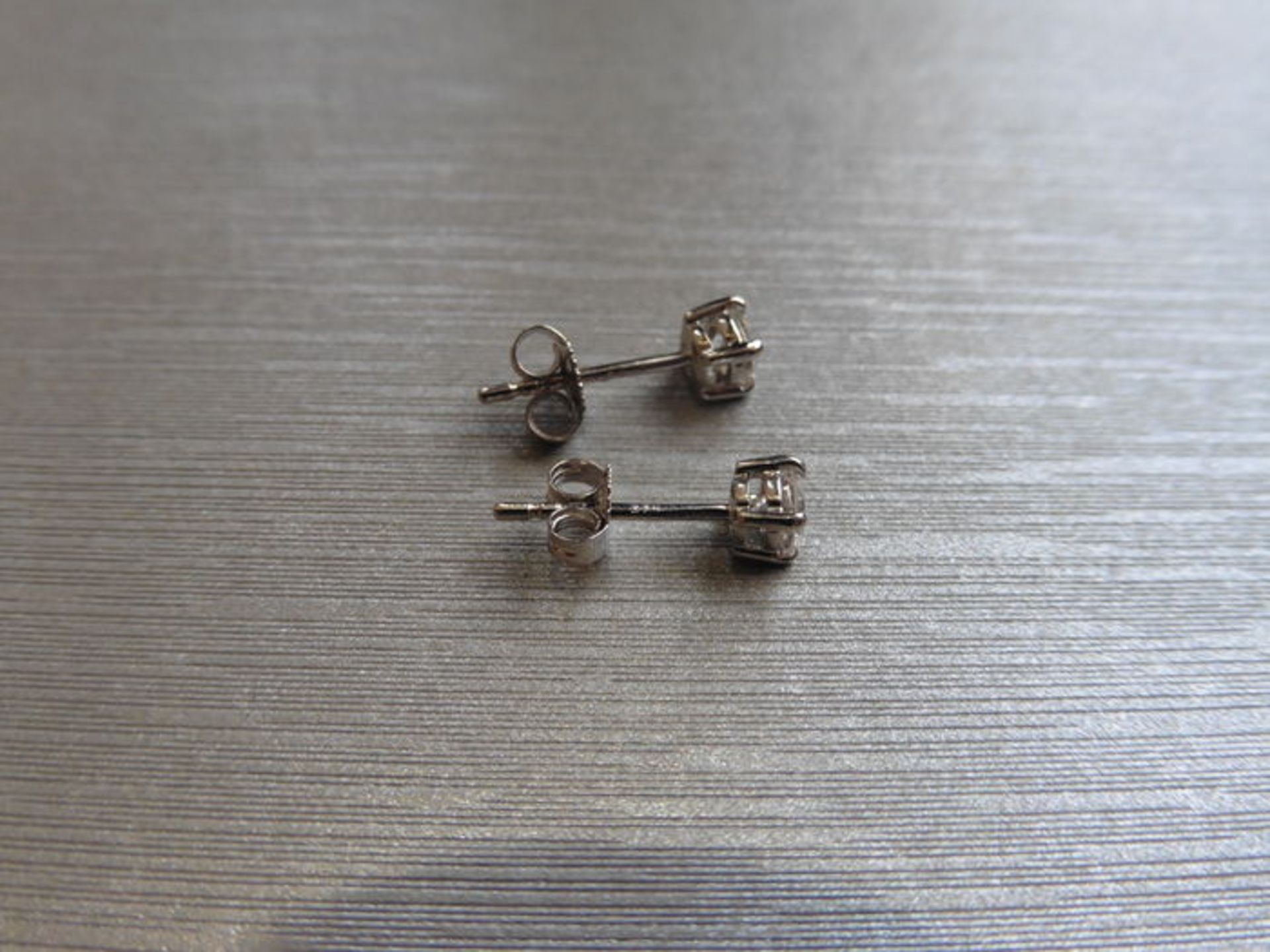 0.30ct diamond solitaire stud earrings set in platinum. I/J colour, si2 clarity.4 claw setting - Image 2 of 2