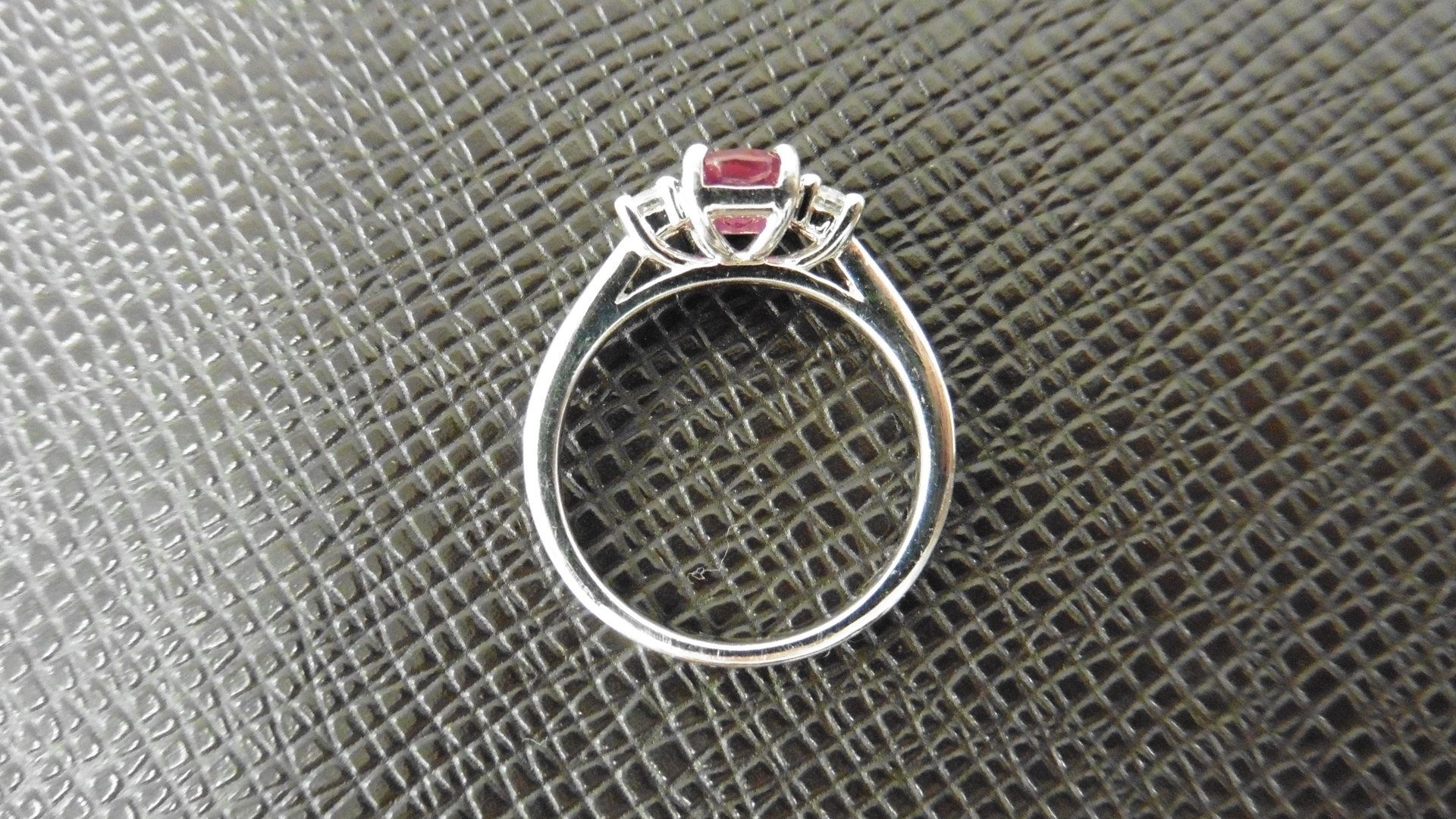 Ruby and diamond trilogy ring. 7 x 5mm oval ruby ( glass filled ) with a brilliant cut diamond - Image 2 of 3
