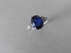 Sapphire and diamond dress ring set in platinum. Oval cut sapphire ( glass filled ) 2.40ct approx