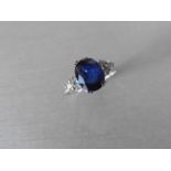 Sapphire and diamond dress ring set in platinum. Oval cut sapphire ( glass filled ) 2.40ct approx