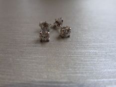 0.60ct Solitaire diamond stud earrings set with brilliant cut diamonds. I colour, si3 clarity Set in