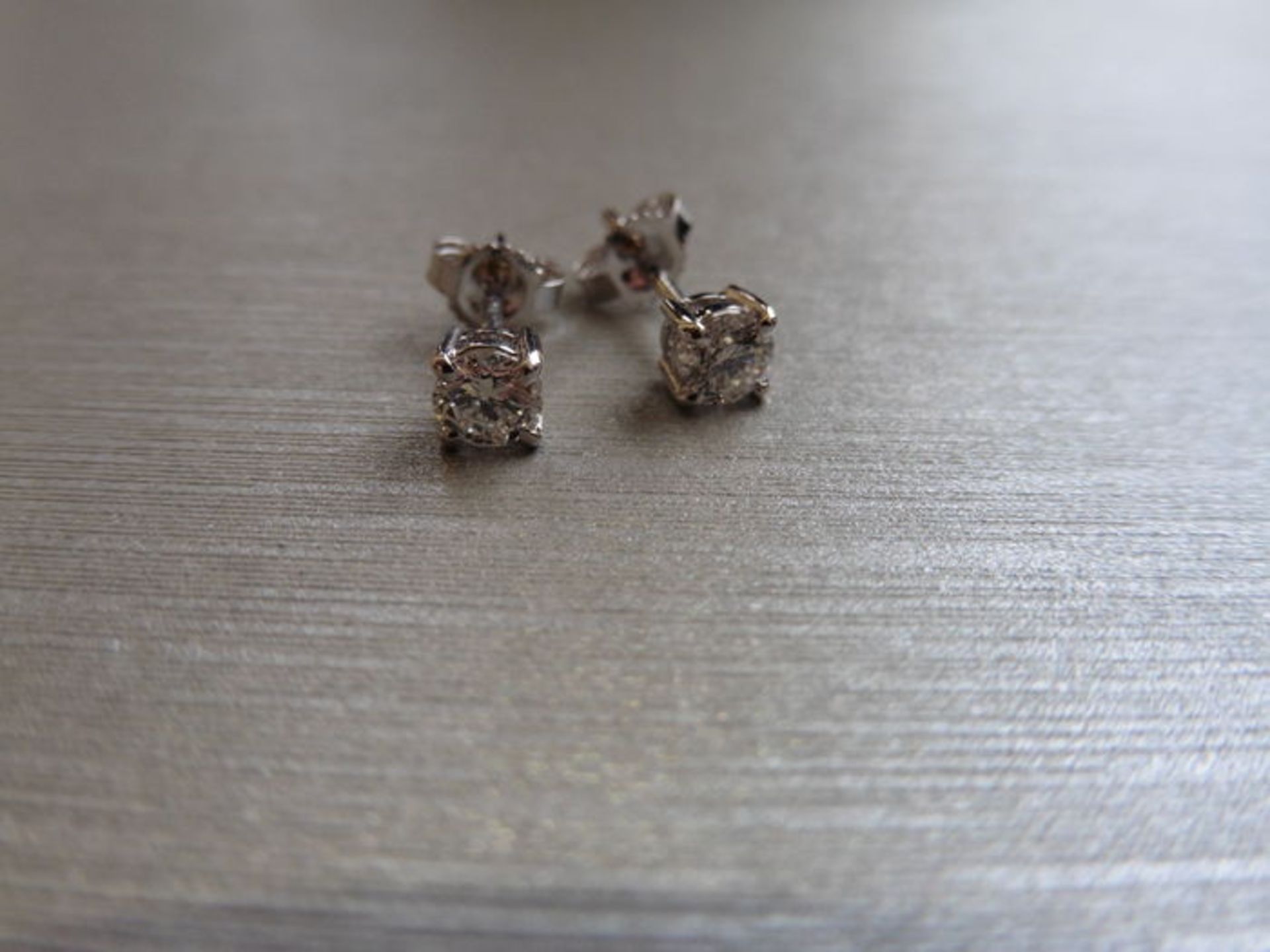 0.60ct Solitaire diamond stud earrings set with brilliant cut diamonds. I colour, si3 clarity Set in