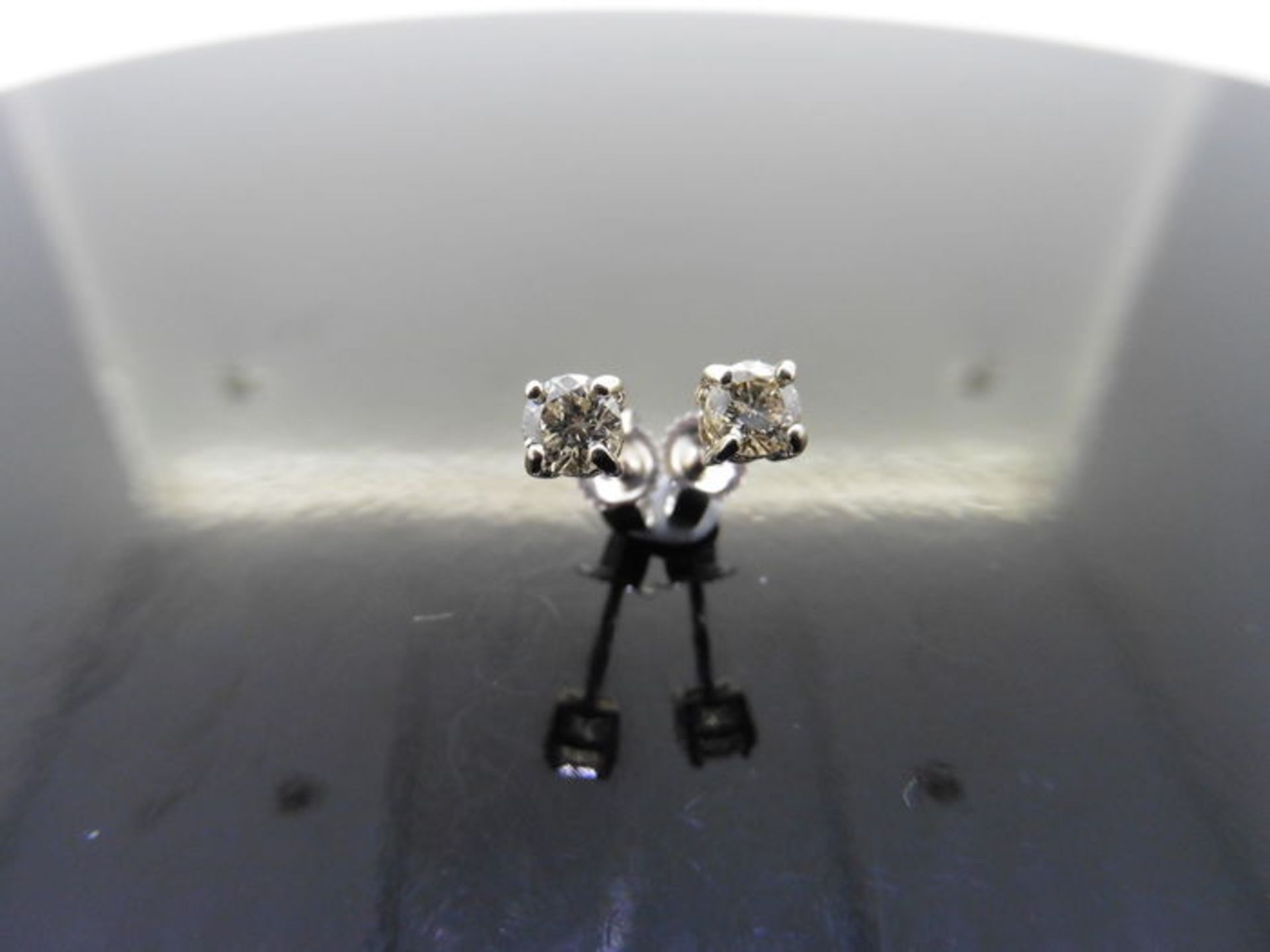 0.50ct diamond solitaire stud earrings set in platinum. I/J colour, si2 clarity.4 claw setting