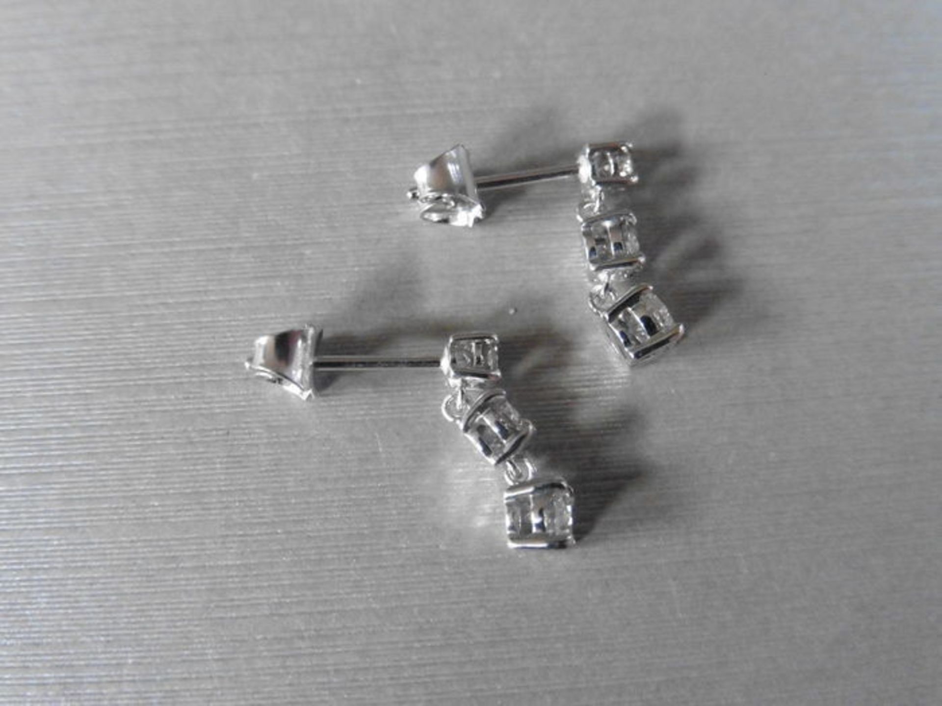 1.20ct trilogy drop earrings set in platinum. 3 graduated brilliant cut diamonds, I colour, Si2-3 - Image 3 of 3