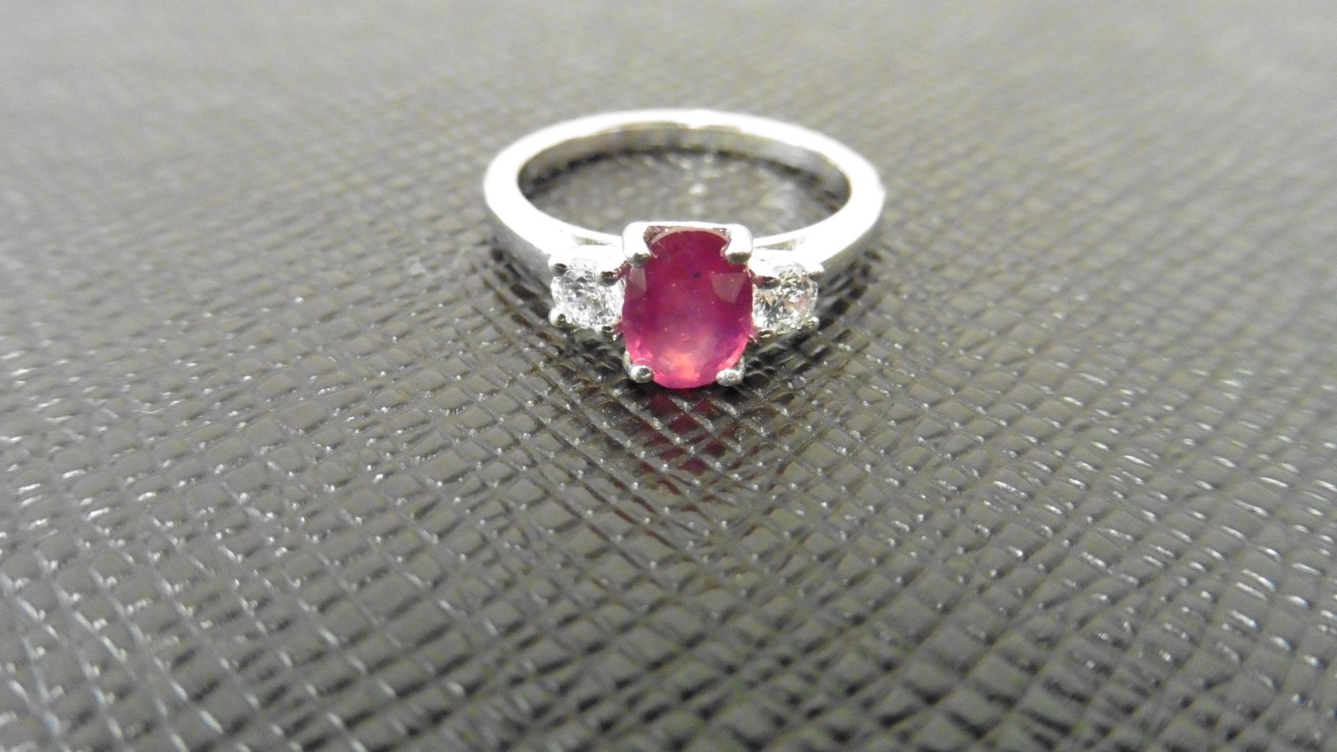 Ruby and diamond trilogy ring. 7 x 5mm oval ruby ( glass filled ) with a brilliant cut diamond - Image 3 of 3