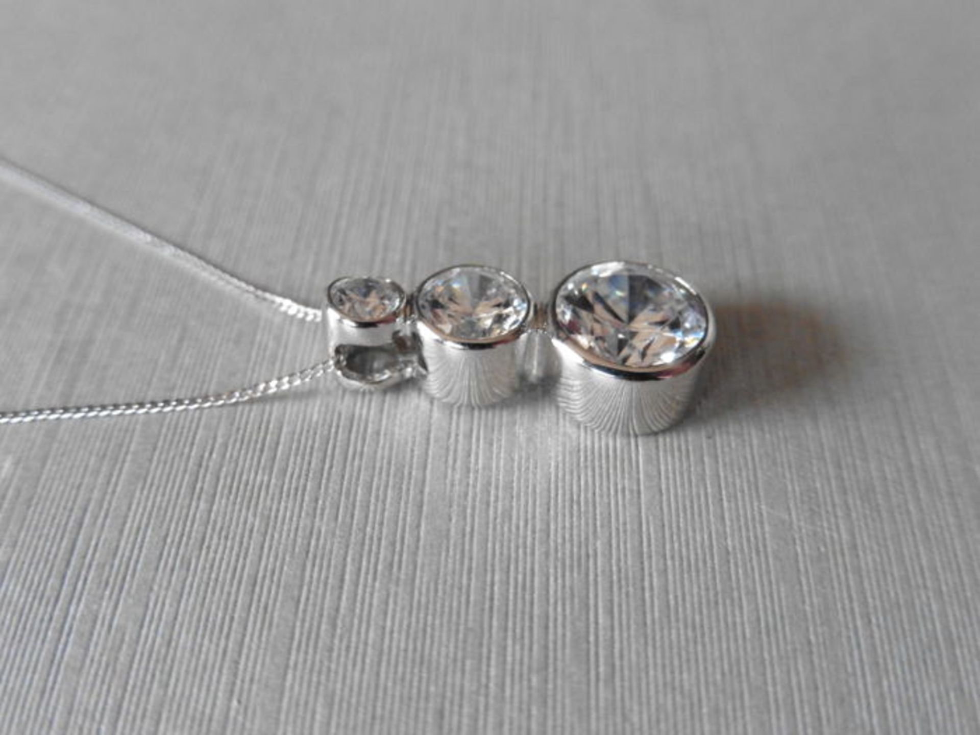 0.80ct trilogy diamond pendant set in platinum. 3 graduated brilliant cut diamonds, I/J colour, - Image 3 of 3