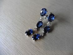 4.80ct sapphire and diamond drop earrings set in platinum. Each set with 3 oval cut sapphires (