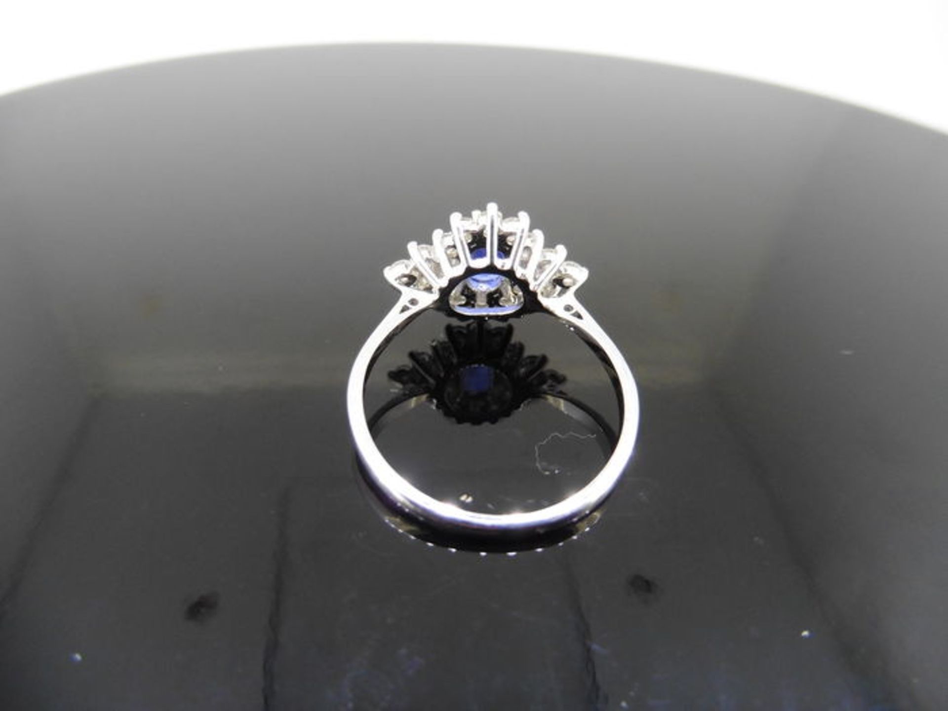 Sapphire and diamond cluster style ring set in platinum. Oval cut ( treated ) sapphire 0.80ct with - Image 3 of 3