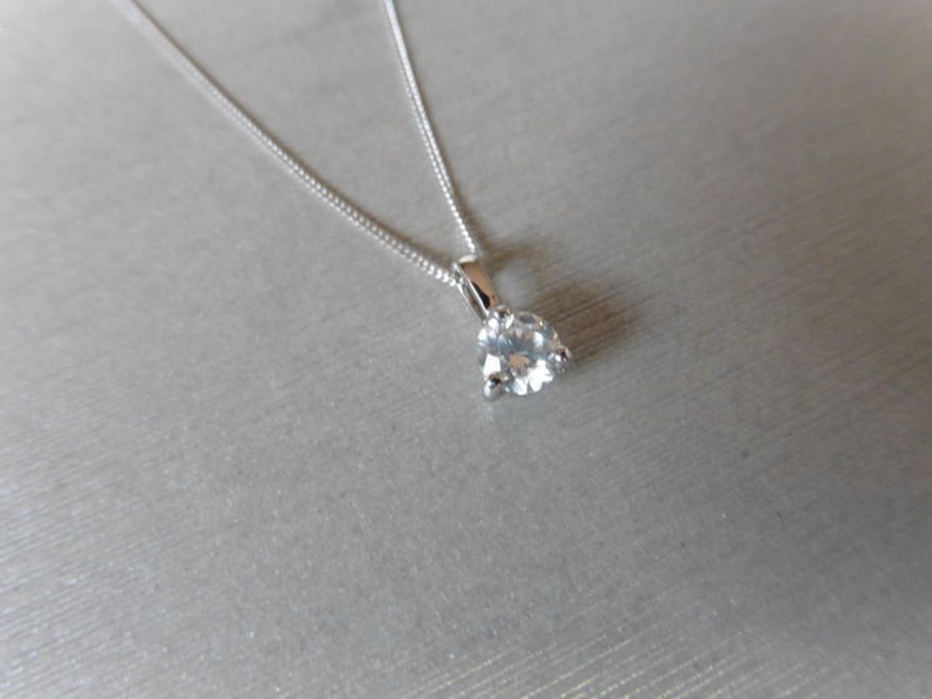 0.30ct diamond solitaire style pendant with a brilliant cut diamond, I colour and si3 clarity. Set