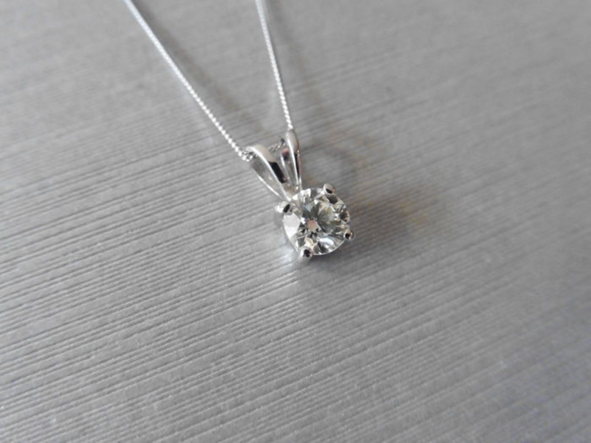 0.40ct diamond solitaire style pendant with a brilliant cut diamond, I/J colour and si2 clarity. Set