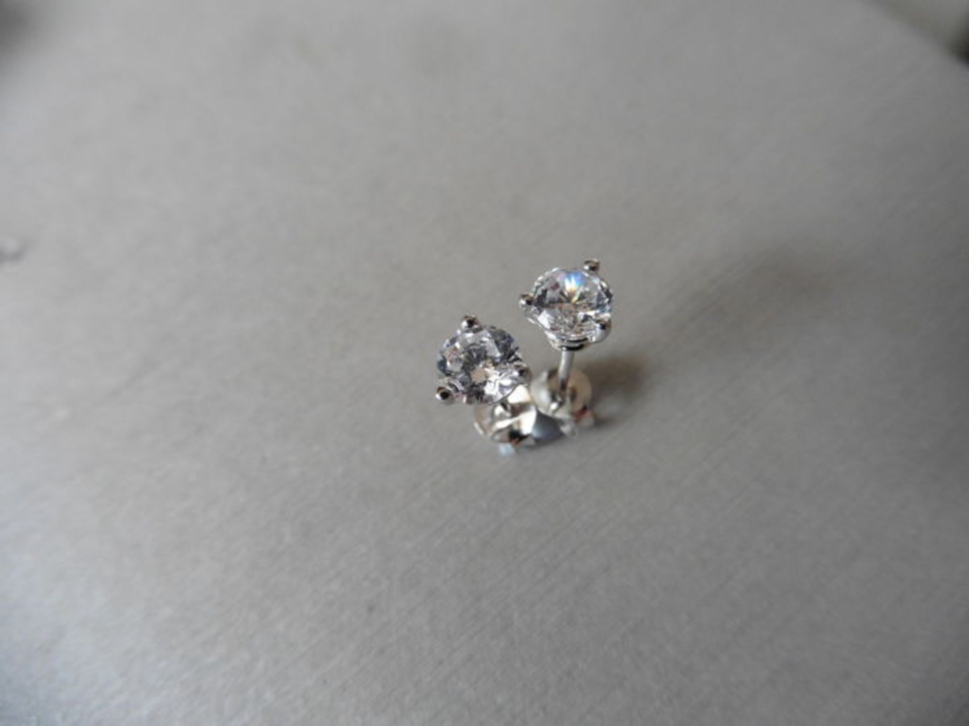 0.70ct diamond solitaire stud earrings set in platinum. I/J colour, si2 clarity.3 claw setting