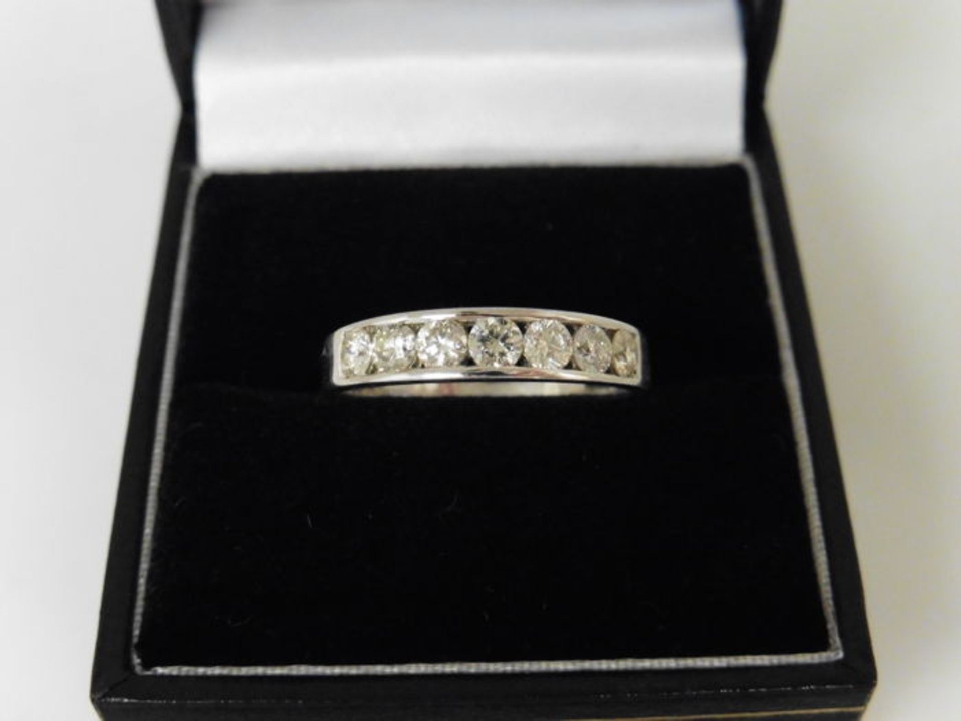 0.70ct diamond band ring set with 7 brilliant cut diamonds in a channel setting. H/I colour and - Image 4 of 4