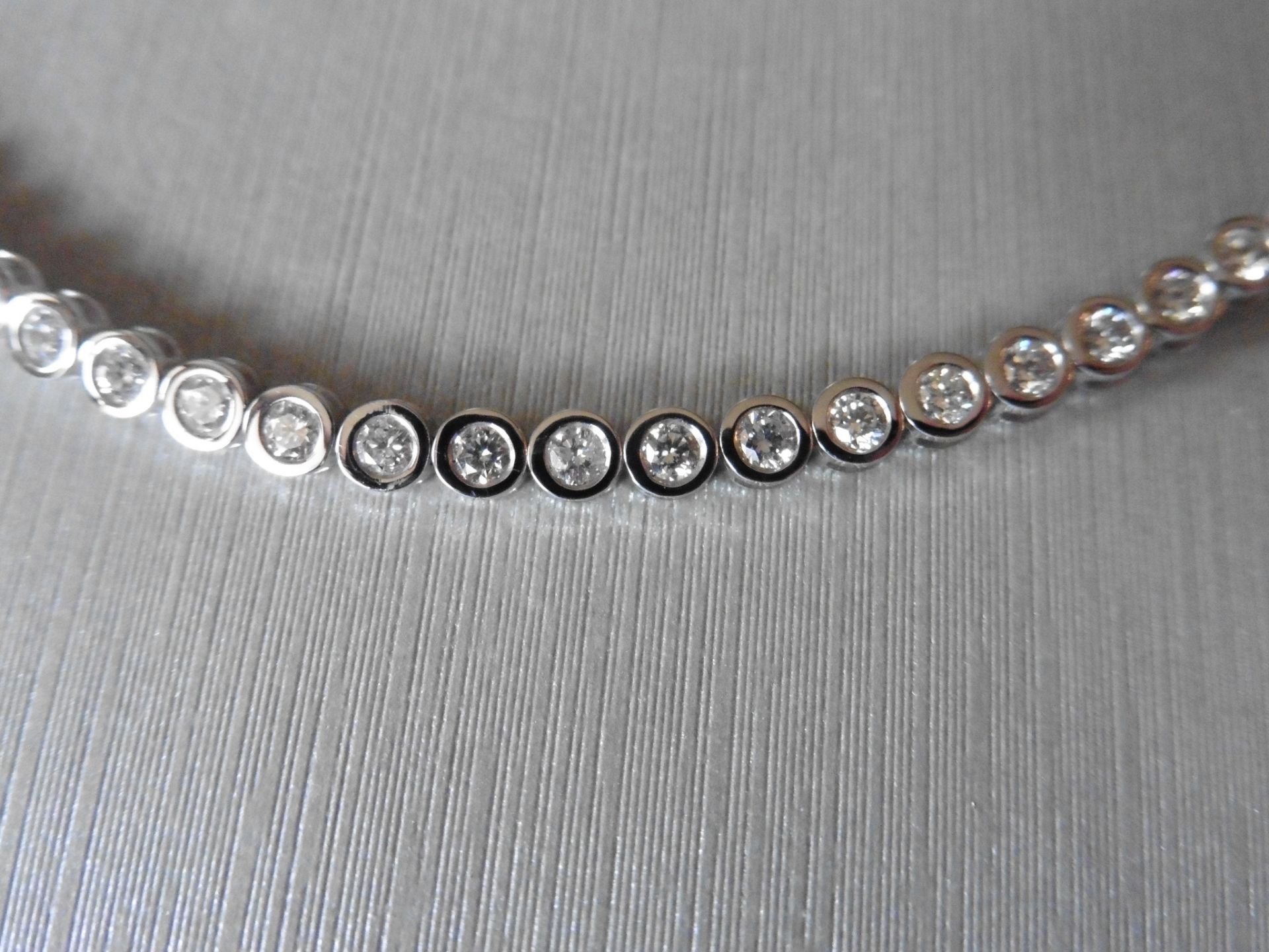 3.10ct 18ct white gold diamond tennis style bracelet set with brilliant cut diamonds. I colour,