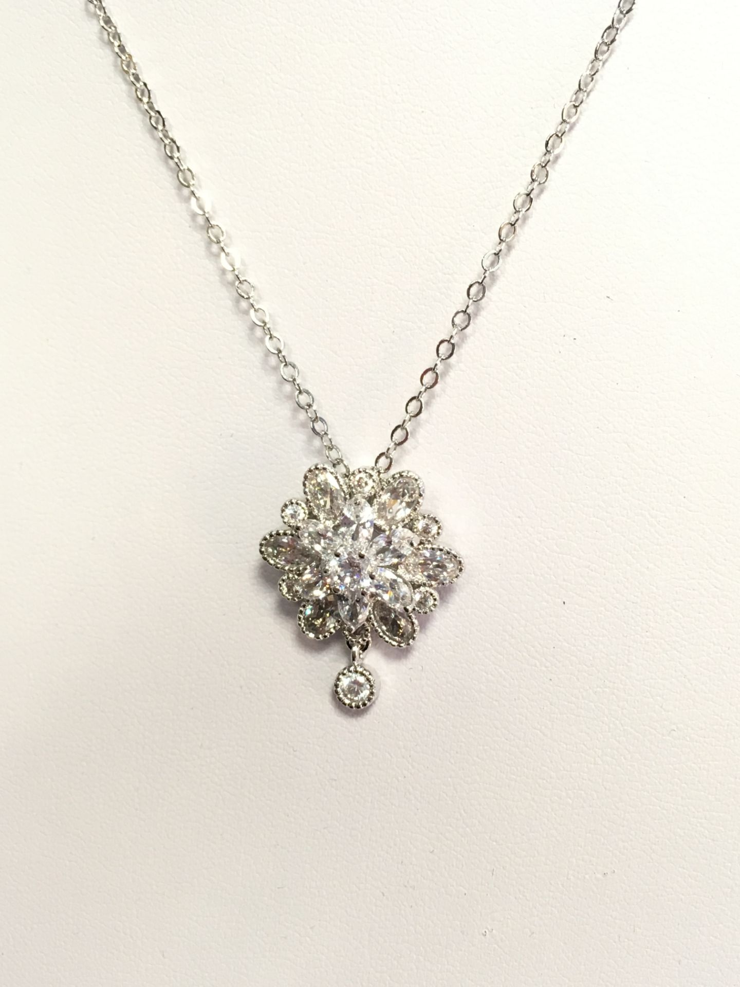 Brand New Platinum Plated, AAA Zirconia Flower Pendant Necklace, Earring and Ring Set - Image 4 of 4