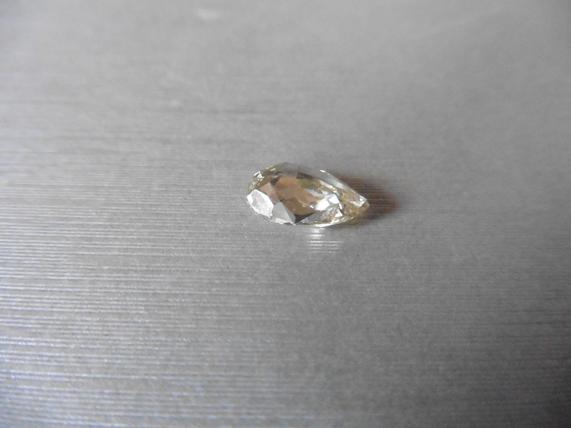 2.14ct single pear shaped diamond, fancy yellow, VVS1 clarity. Measures 11.05 x 6.70 x 4.08mm. HRD - Image 3 of 6