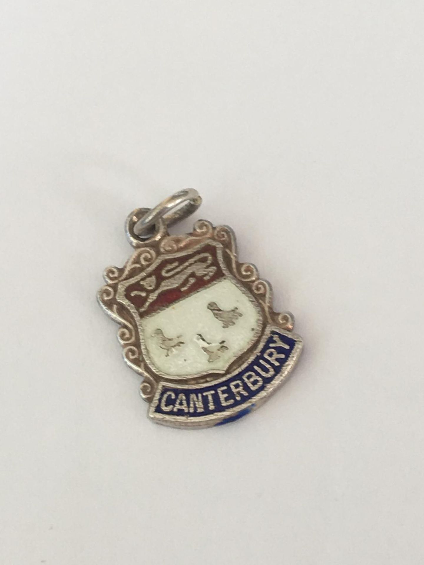 Small enamelled Canterbury silver fob