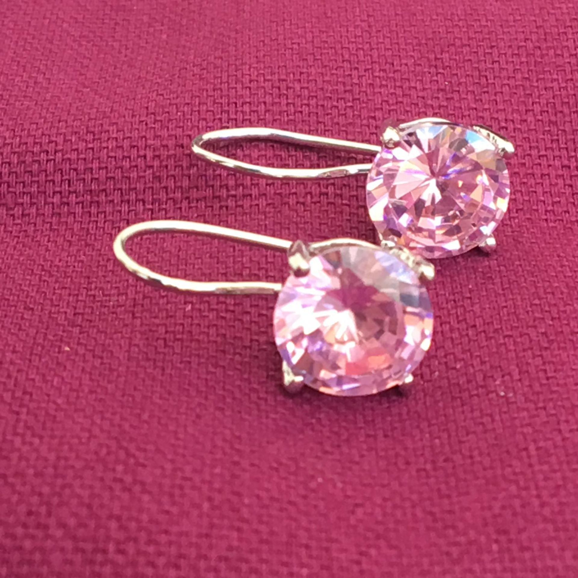 925 silver lever back earrings, each one set with a large pale pink stone