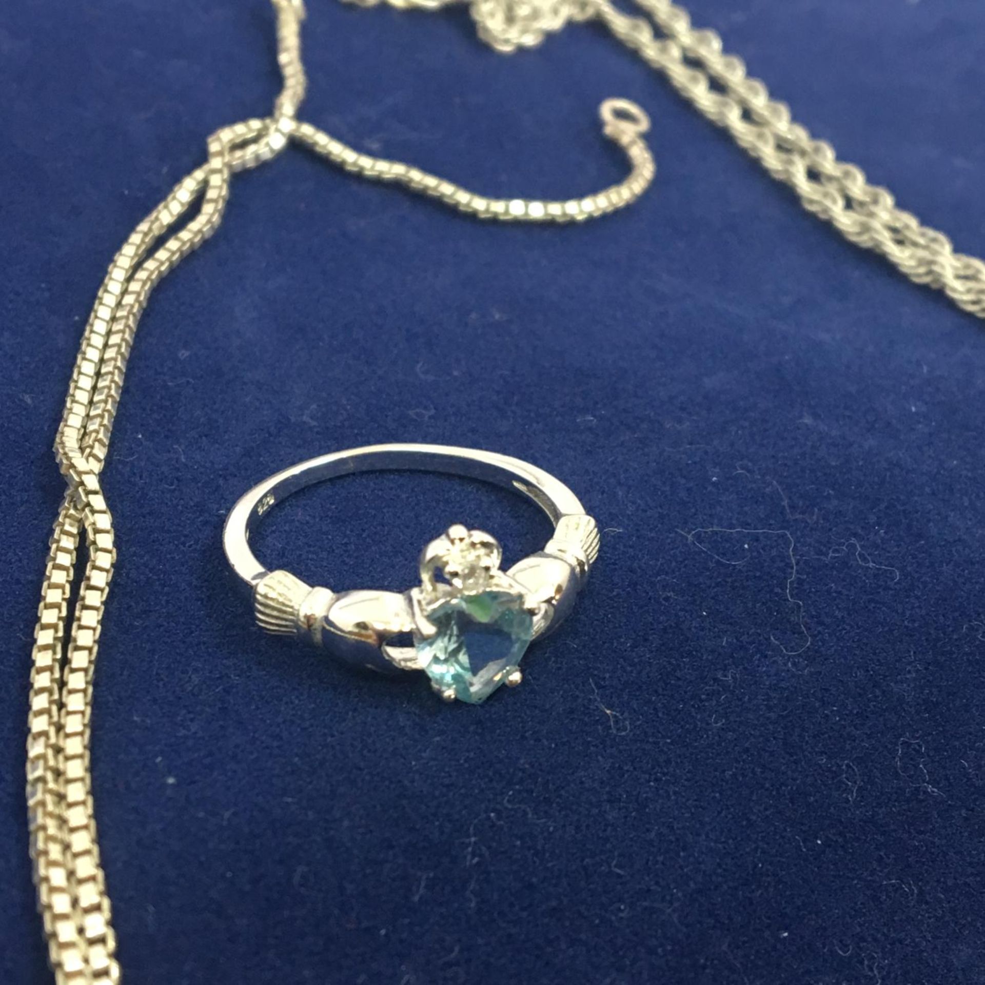 A selection of pre-owned 925 silver jewellery to include a blue stone claddagh ring and two chains - Image 2 of 2